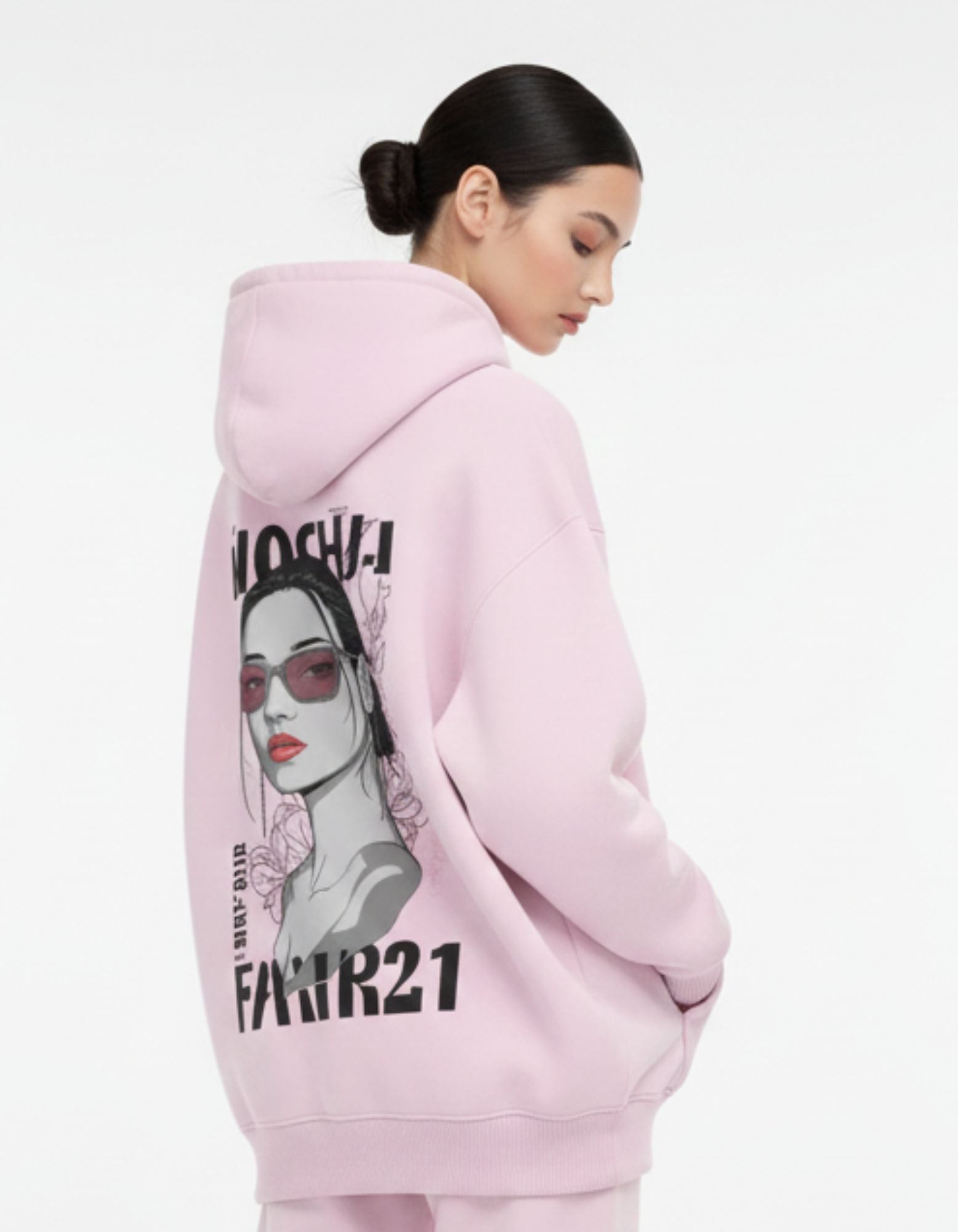 Close-up of the aesthetic back print on a pink heavyweight fleece hoodie showing a detailed girl illustration with sunglasses.