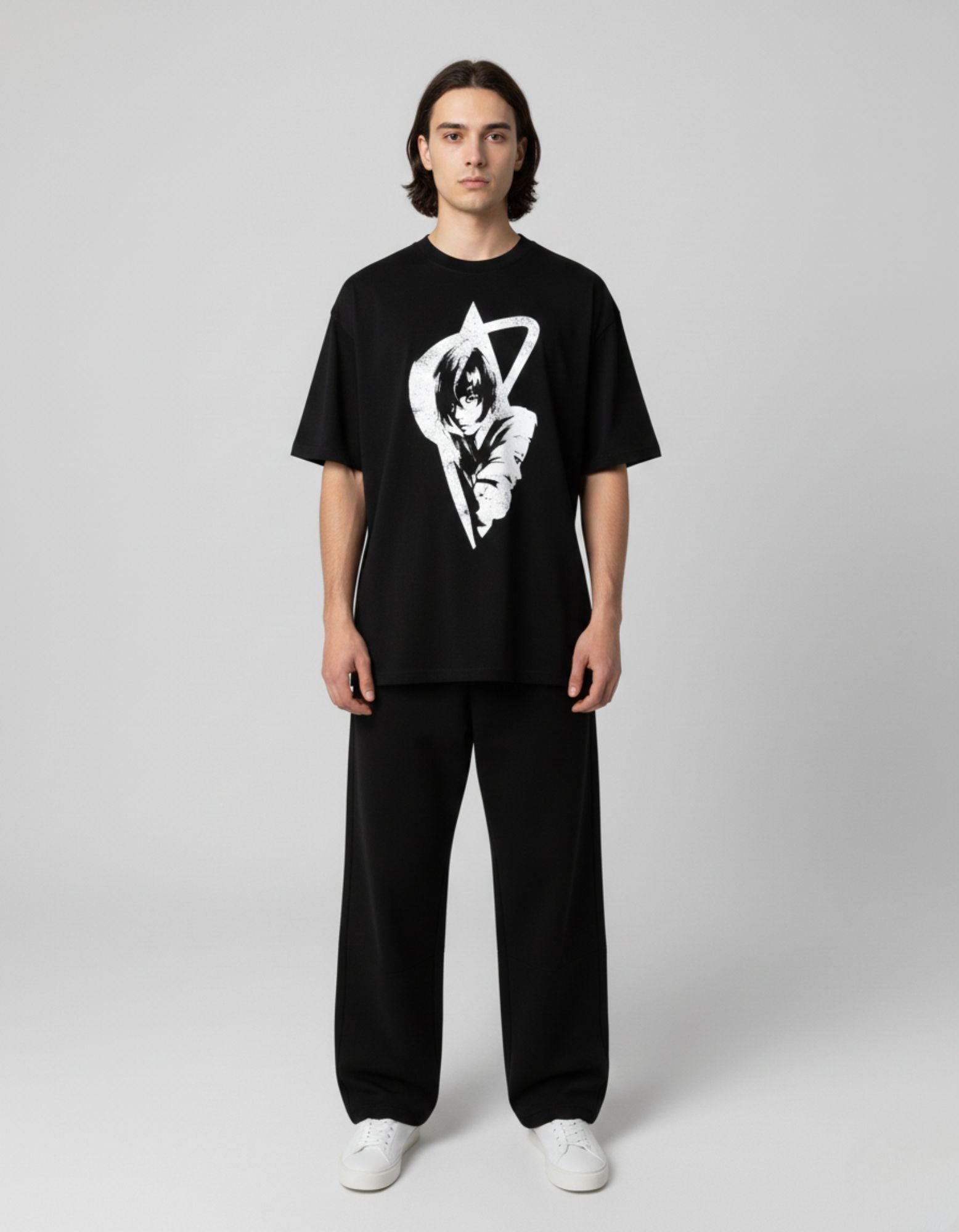 Front view of a man wearing a GENZs Fashion oversized black t-shirt with a white anime girl graphic print.
