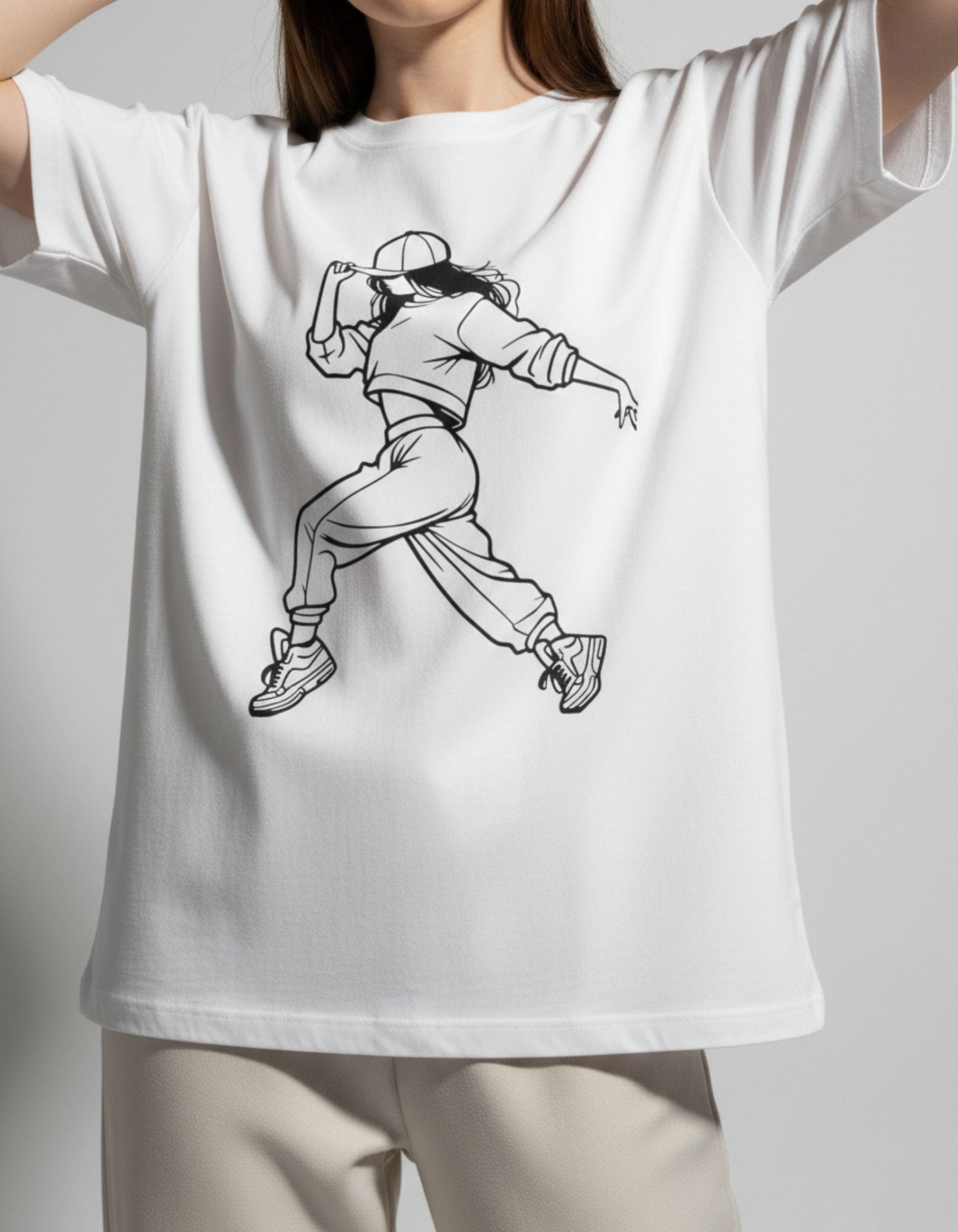 Close-up of a detailed black line-art anime dancer graphic on a premium white oversized cotton t-shirt.