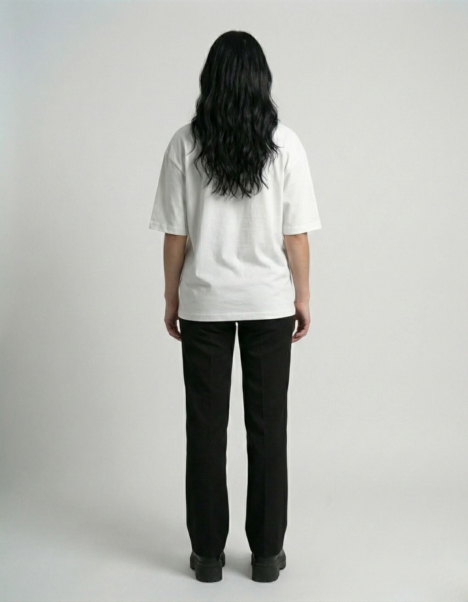 "Back view of unisex white oversized t-shirt showing the premium fabric and clean drop shoulder stitch."