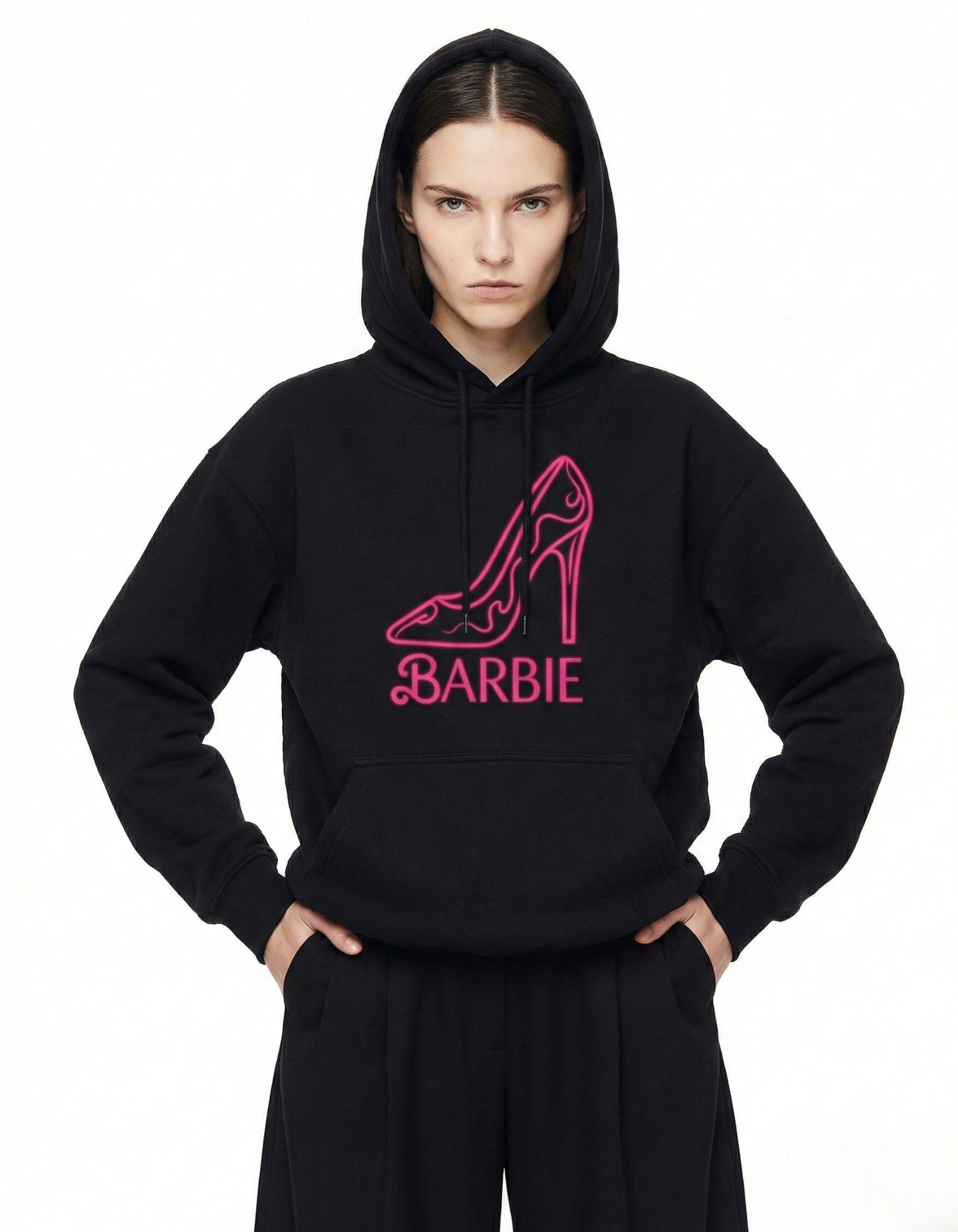 Oversized black hoodie for women featuring a pink neon high-heel shoe graphic and Barbie logo from GENZs Fashion streetwear.
