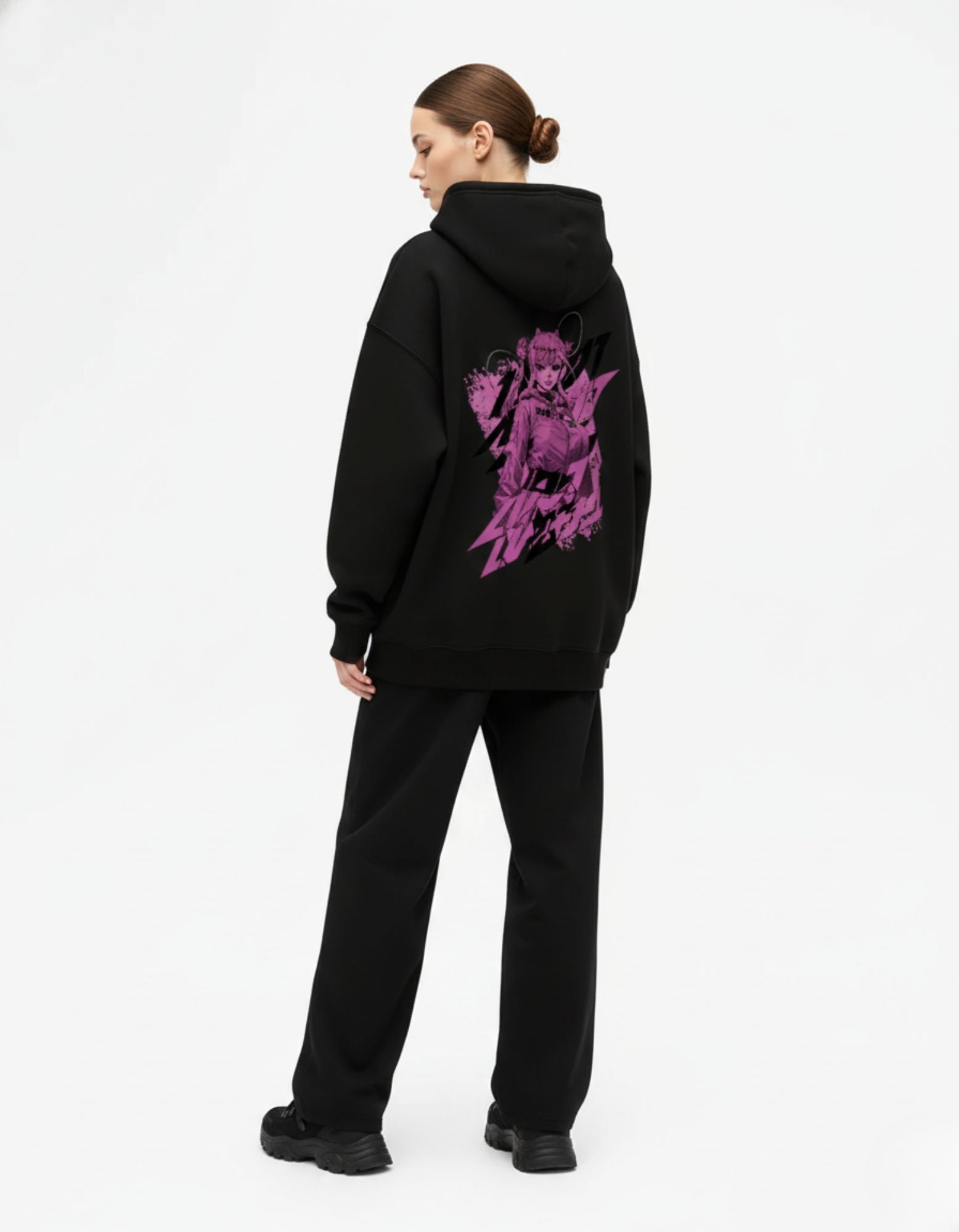Angled back view of black oversized hoodie with anime graphic artwork
