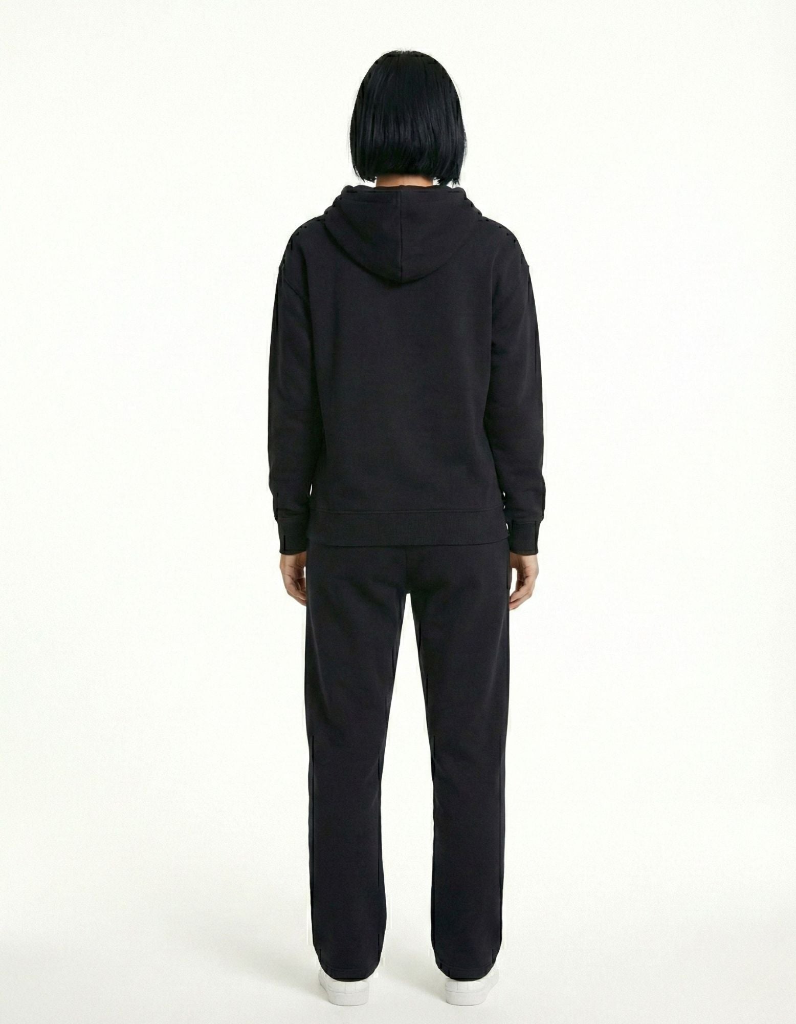 Back view of black oversized hoodie with clean plain back design

