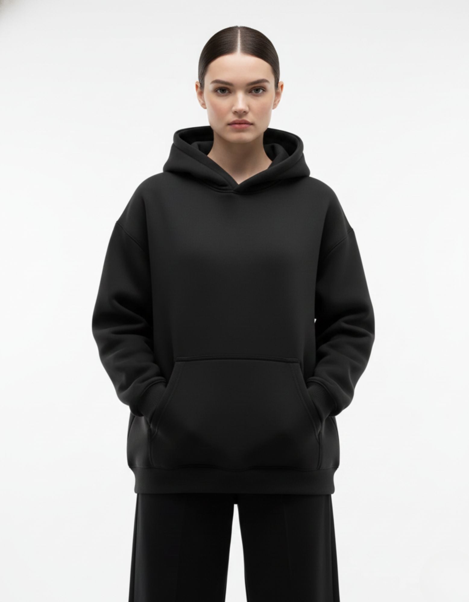 Front view of black oversized hoodie with clean minimalist design
