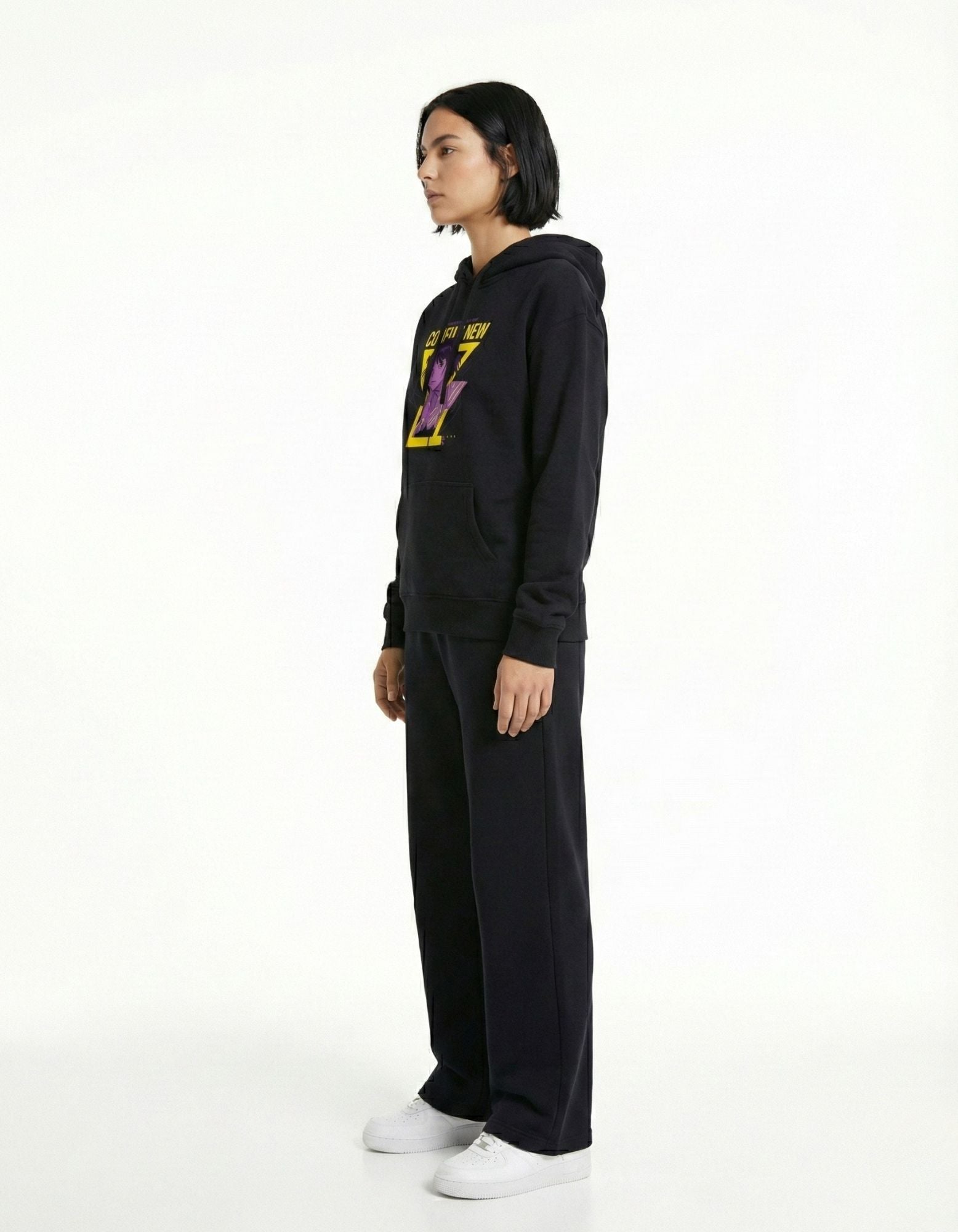 Side view of black oversized hoodie showing relaxed oversized fit
