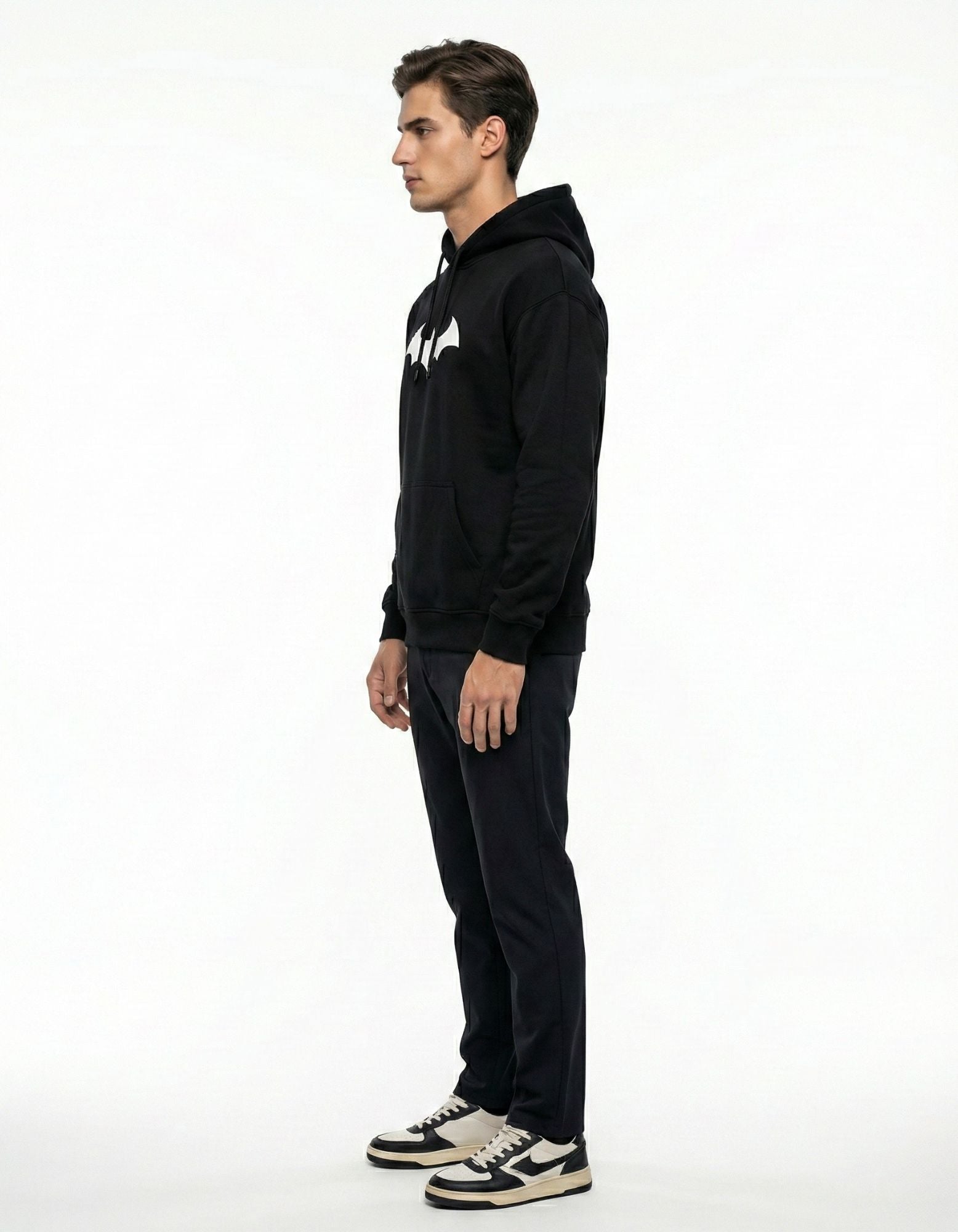 Side profile showcasing the baggy, drop-shoulder oversized fit of the GENZs Fashion black graphic hoodie.