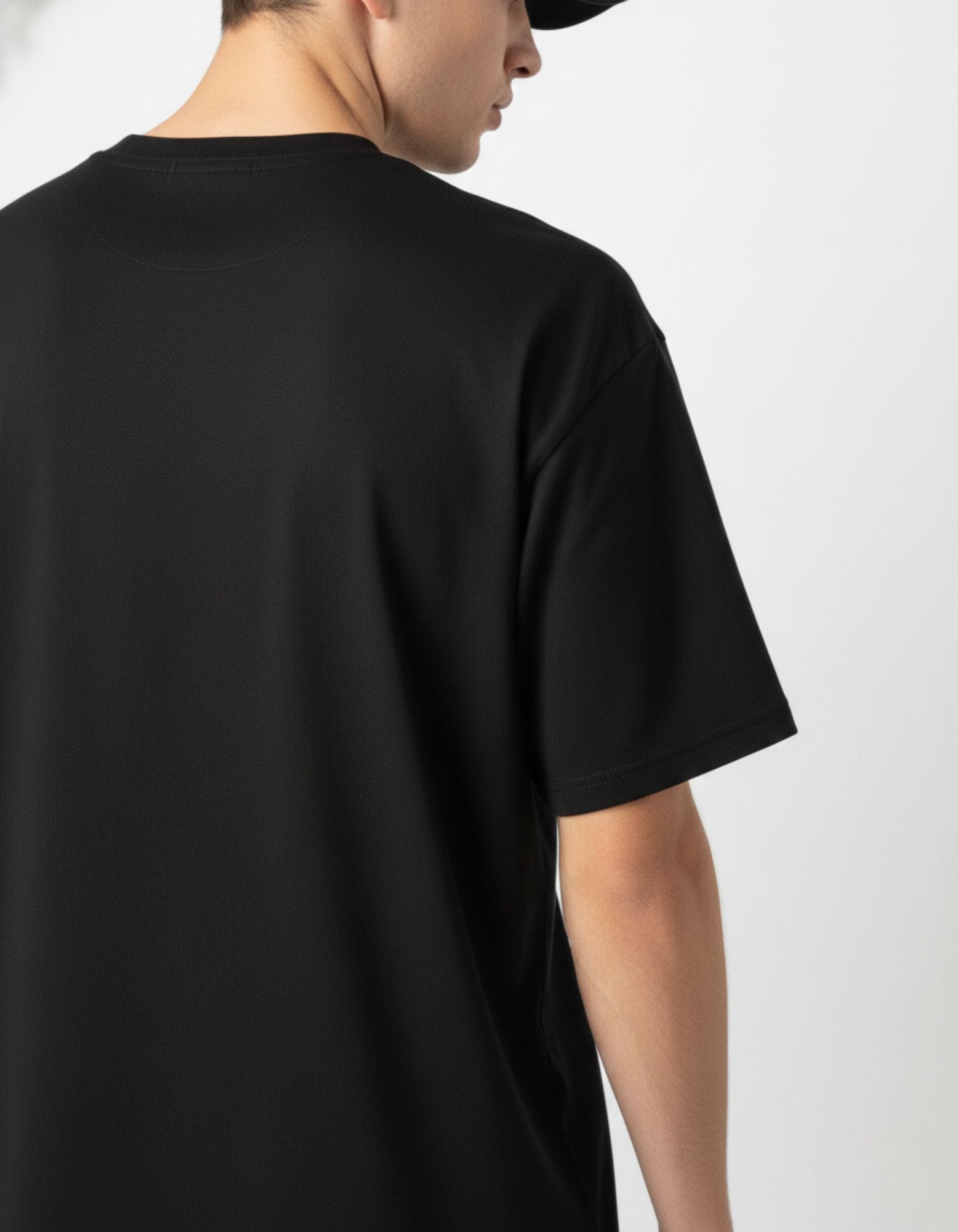 Back view of plain black oversized t-shirt for men, premium 100% cotton India.