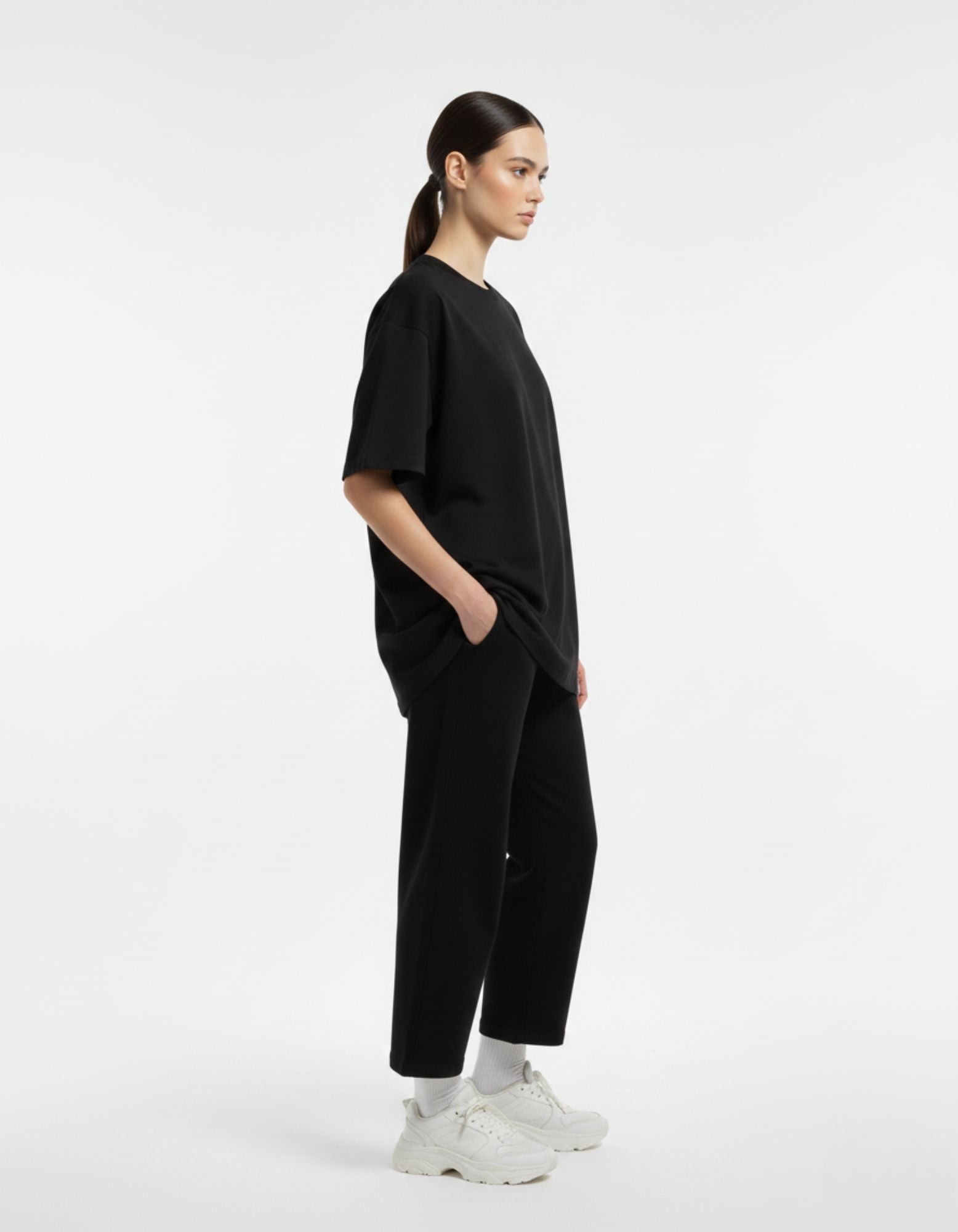 Side profile of a premium black oversized streetwear t-shirt for women by GENZs Fashion.