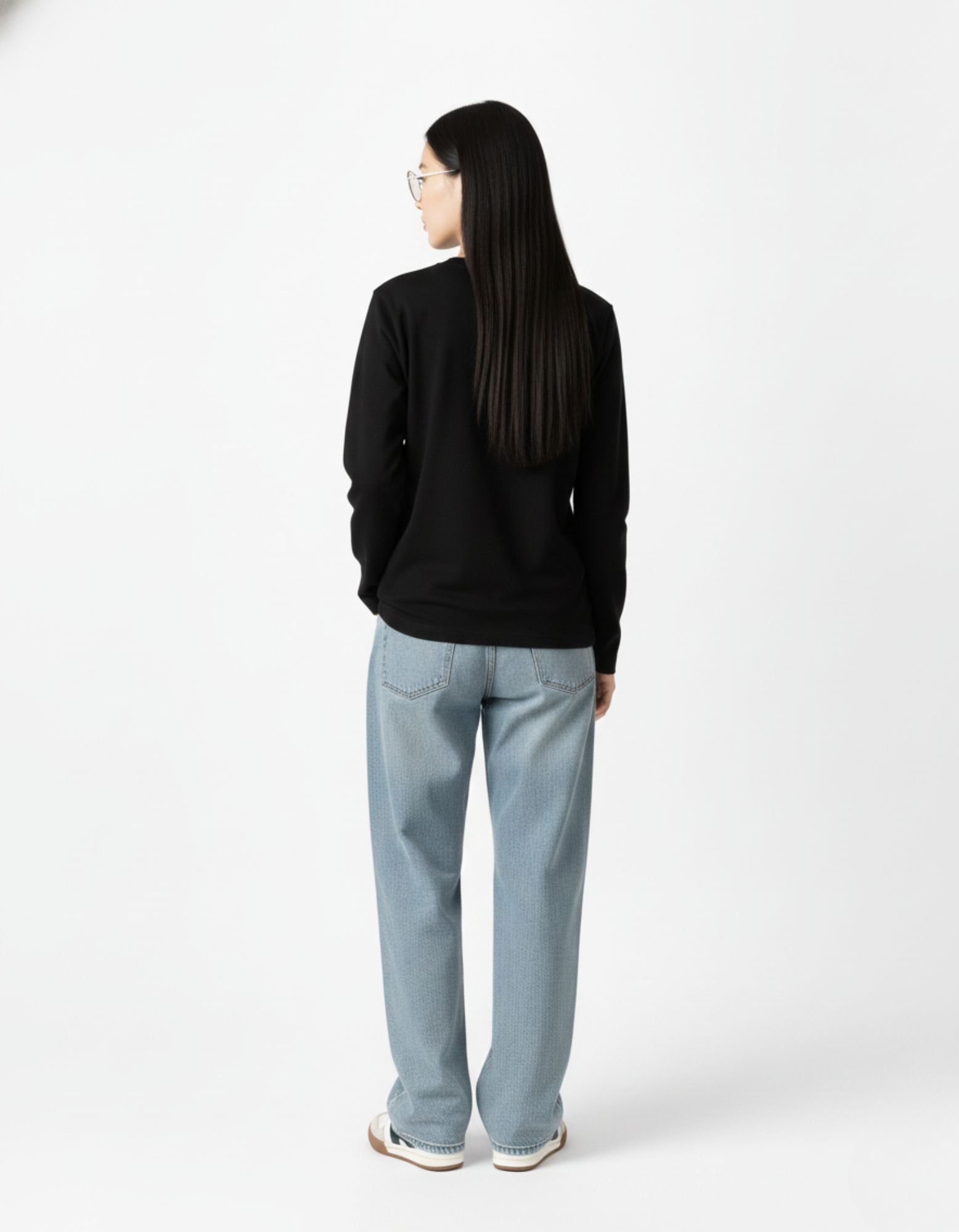 Back view of a premium 240 GSM cotton oversized black sweatshirt for women, showcasing the relaxed drop-shoulder silhouette popular in Indian Gen Z fashion.