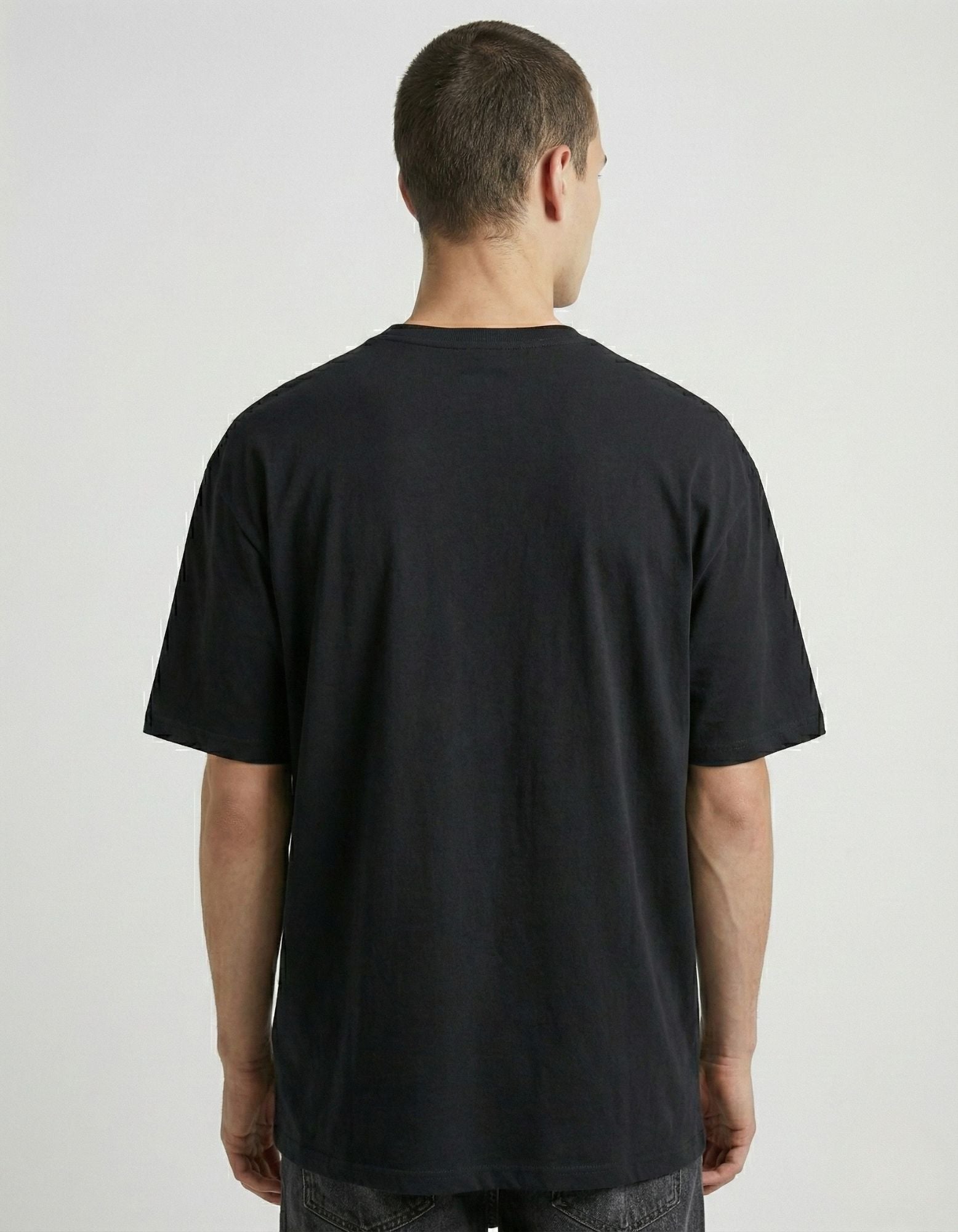 Back view of a plain black oversized t-shirt for men from GENZs Fashion India showing the relaxed fit.