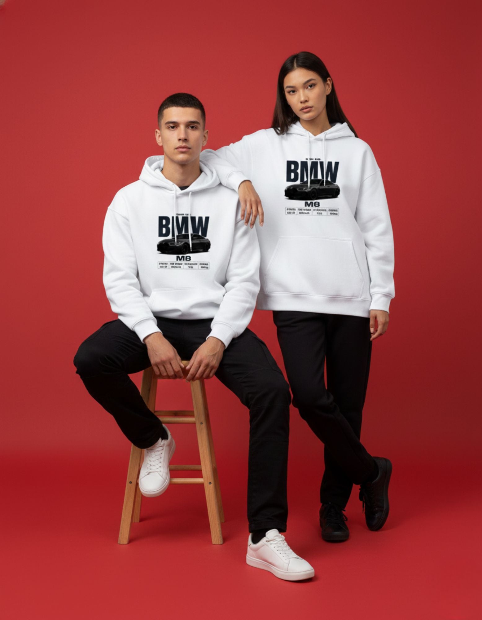 Unisex white BMW M8 graphic hoodies by GENZs Fashion, styled for couples in a modern streetwear aesthetic.