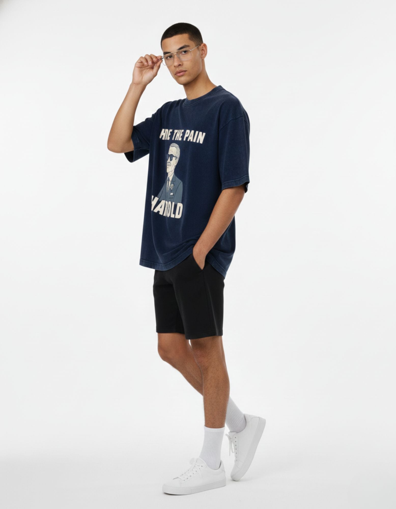 Side view of male model in boxy fit navy blue meme streetwear t-shirt.
