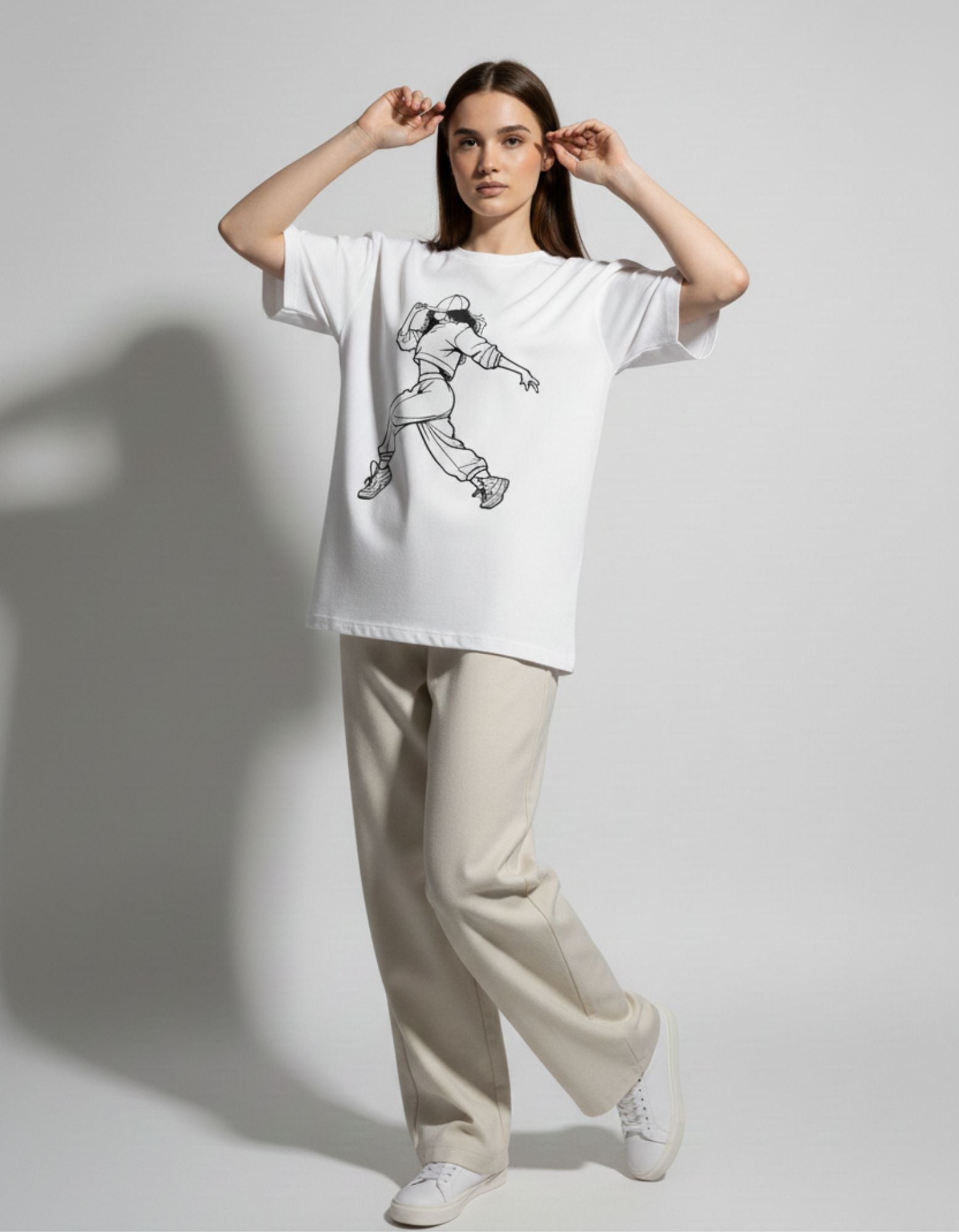 Full-length pose of a female model in an anime-inspired white oversized t-shirt, perfect for Gen Z fashion trends.