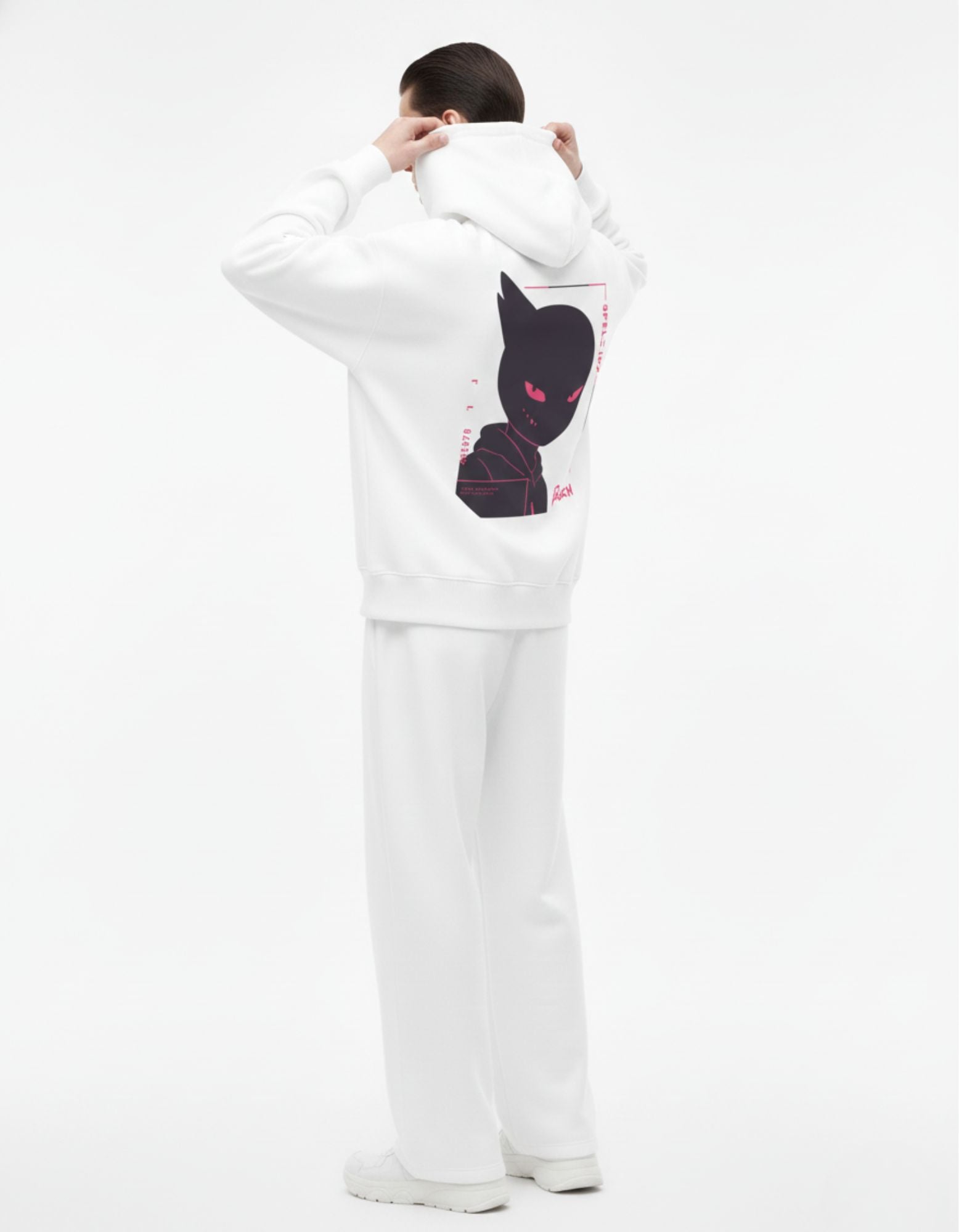 Male model in white GENZs Fashion hoodie featuring a stylized black anime character with glowing pink eyes, cyber-aesthetic streetwear.