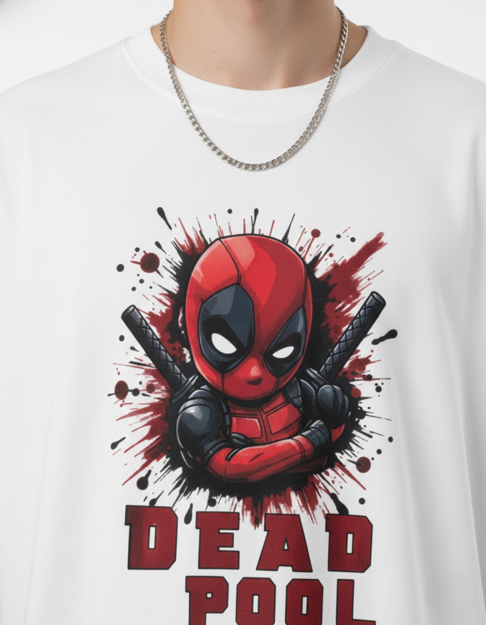 Detailed close-up of vibrant Deadpool graphic print on white high-quality cotton oversized t-shirt for Marvel fans.