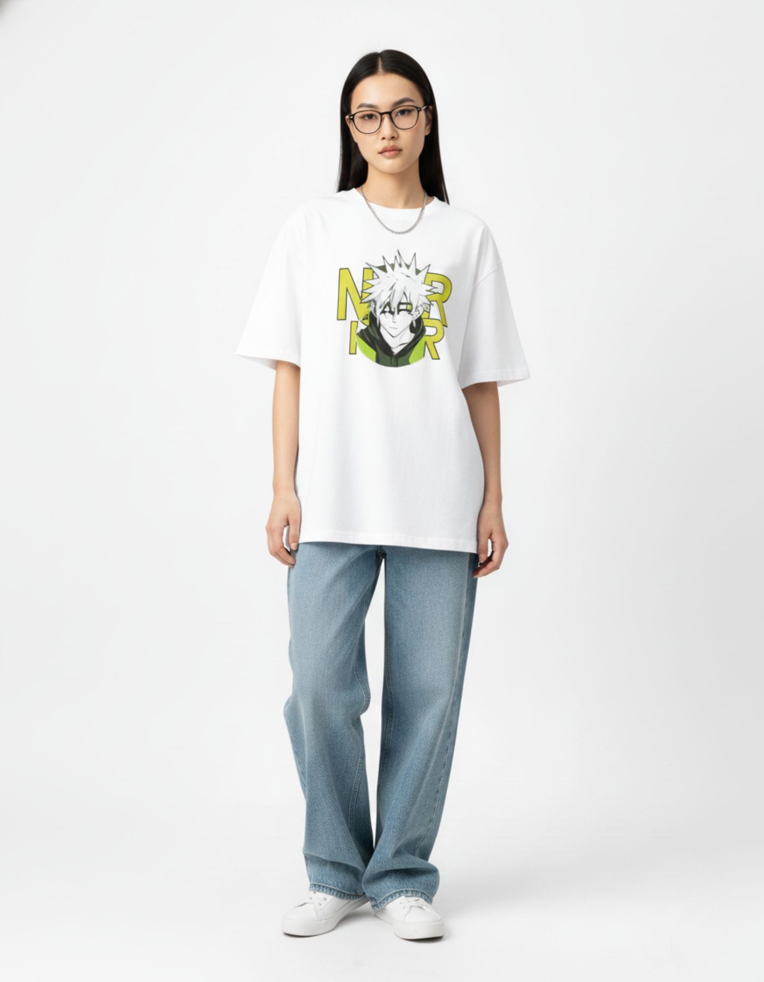 "Male model posing in a white oversized anime-inspired graphic t-shirt with baggy blue jeans by GENZs Fashion."