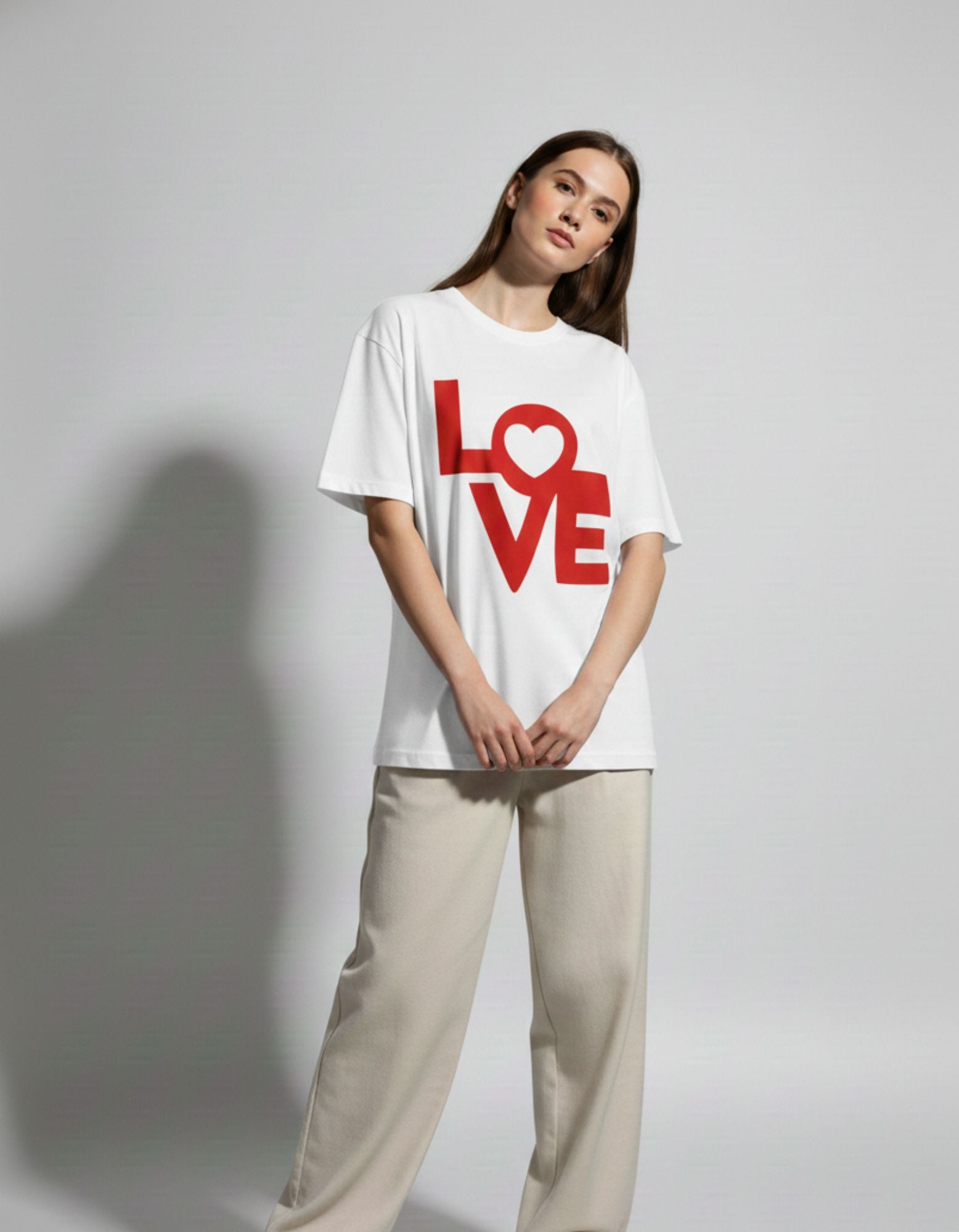 White oversized streetwear tee for women by GENZs Fashion, featuring a red LOVE heart print for a minimalist aesthetic.