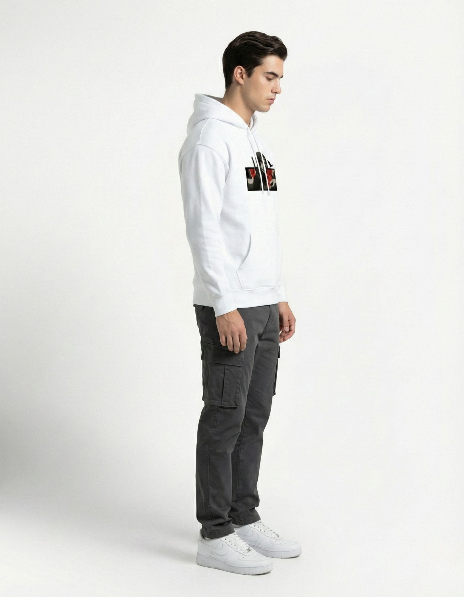 Side profile of a model wearing a GENZs Fashion white anime graphic hoodie, highlighting the comfortable streetwear silhouette.