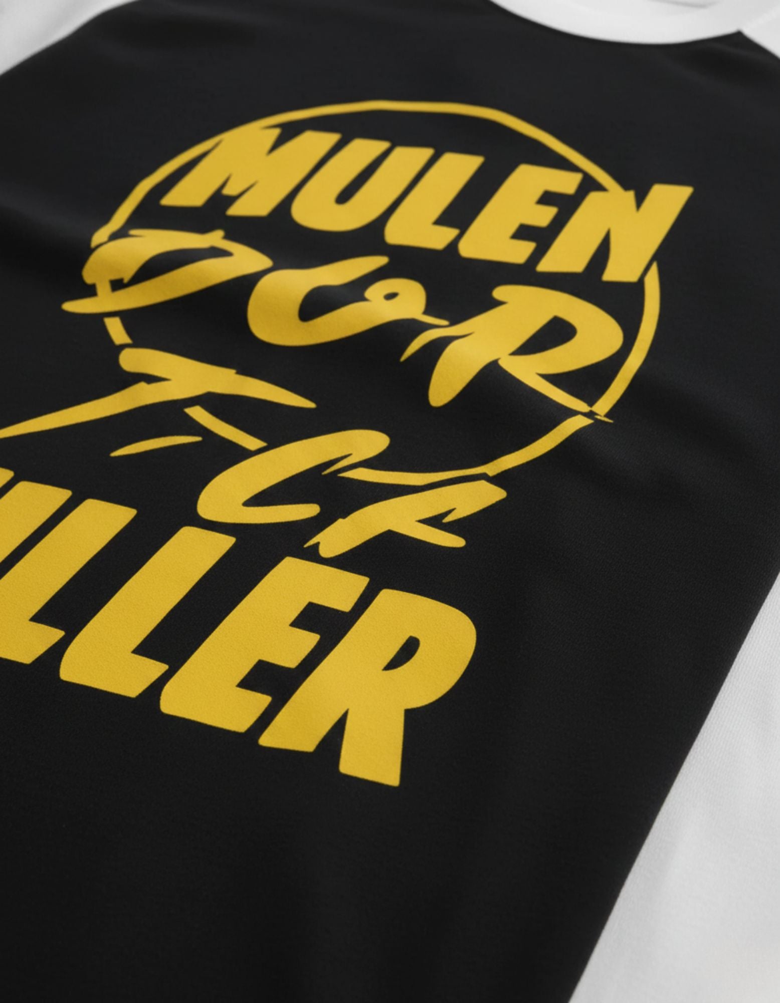 Close-up of the premium yellow typography print on GENZs Fashion raglan tee, highlighting the high-quality fabric texture.