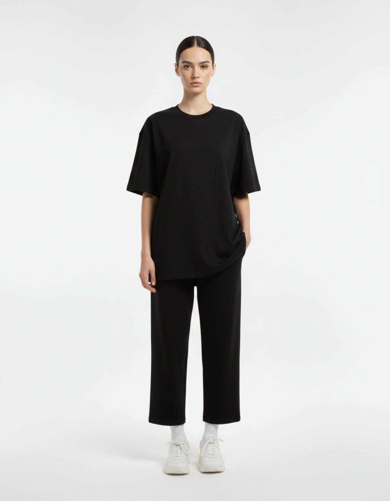 Front view of a minimalist, heavyweight plain black oversized t-shirt from GENZs Fashion streetwear collection.
