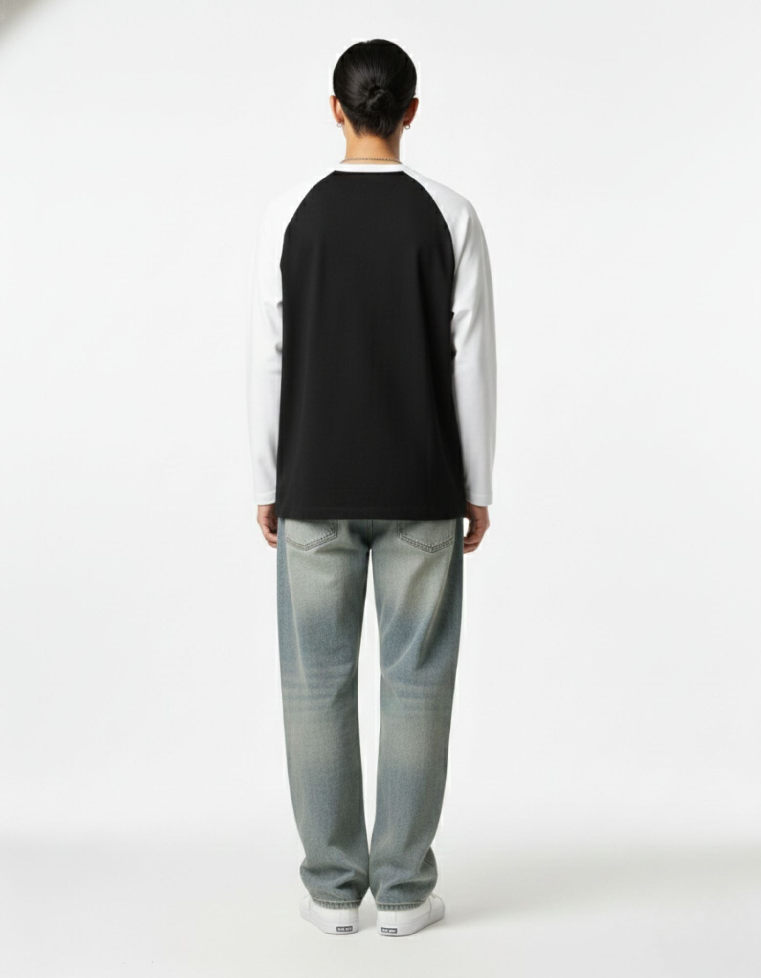 Back view of GENZs Fashion black and white raglan sleeve t-shirt, showing the premium structured fit and minimalist design.