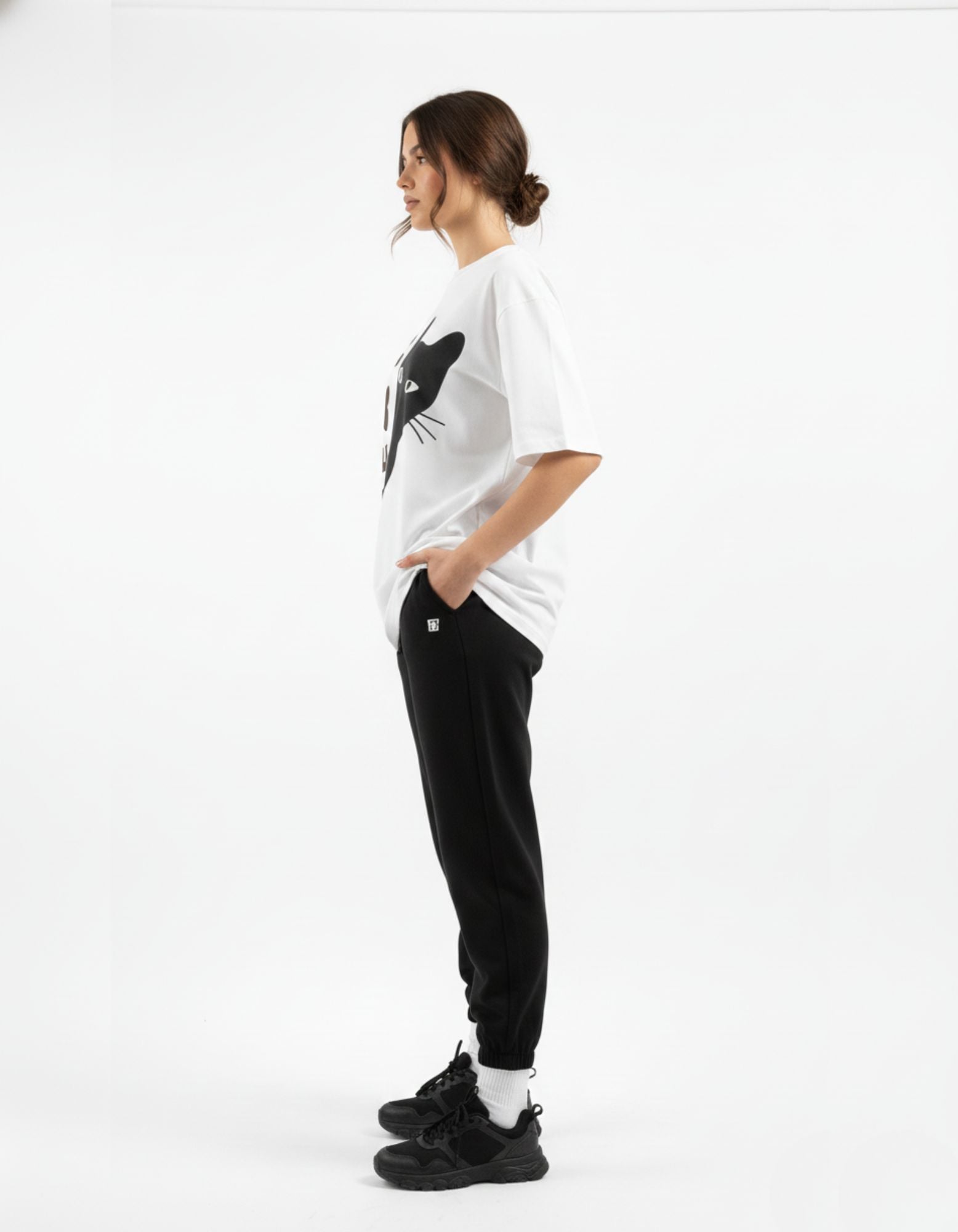 Side view of GENZs Fashion white graphic baggy tee, showcasing the premium drop shoulder fit and high-quality 240 GSM fabric.