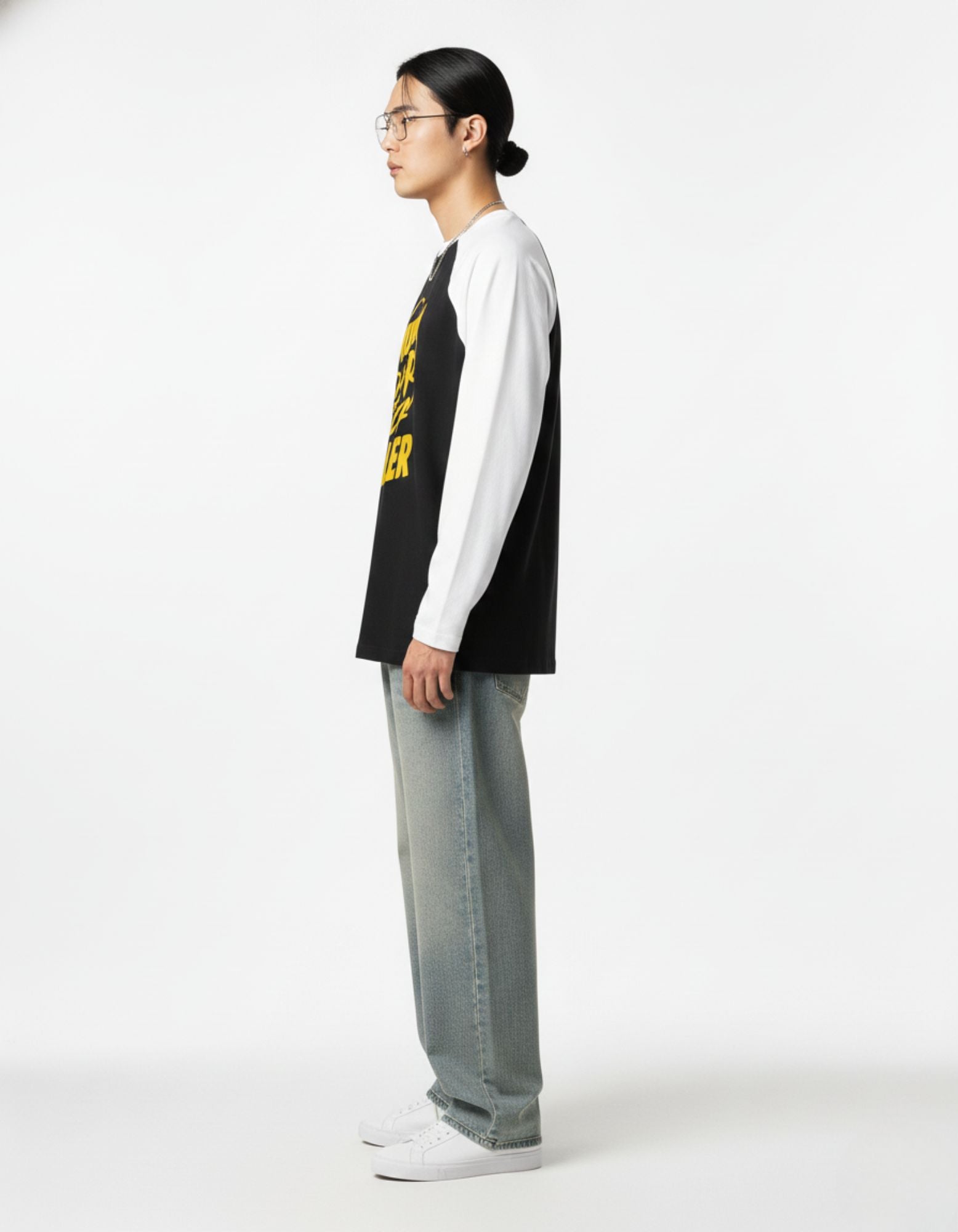 Side profile of GENZs Fashion dual-tone raglan tee, featuring the comfortable drop-shoulder varsity sleeve design.
