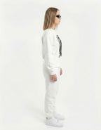 Side view of a model walking in a white 'Silent Vision' manga girl sweatshirt and matching white sweatpants.