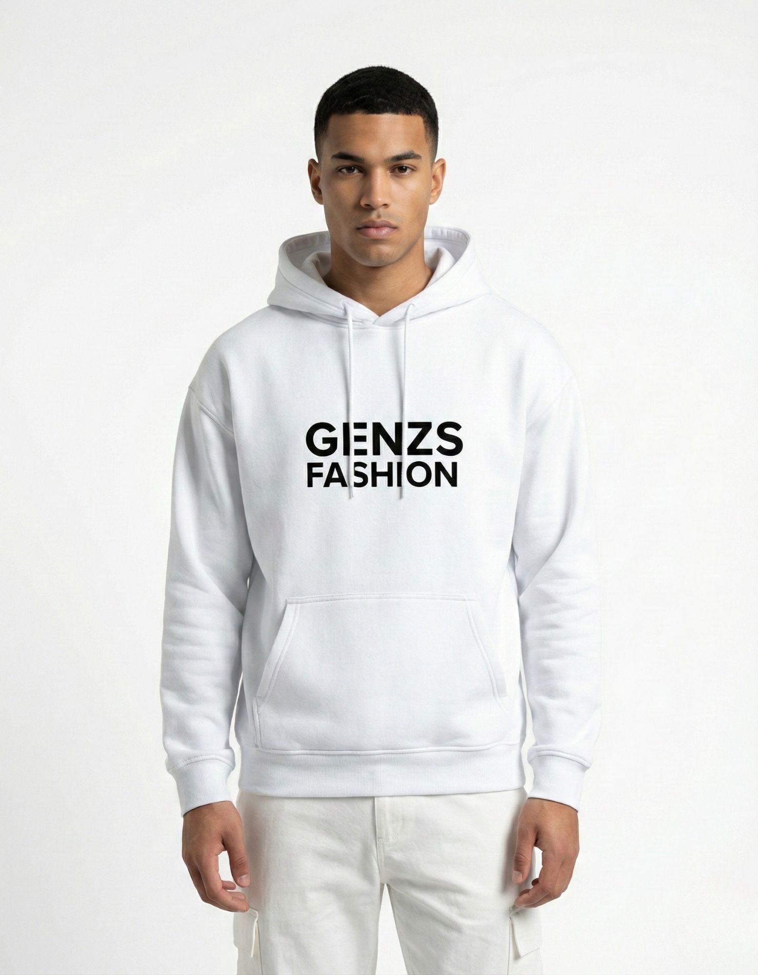 Male model wearing a GENZs FASHION white oversized hoodie with white cargo pants and sneakers.