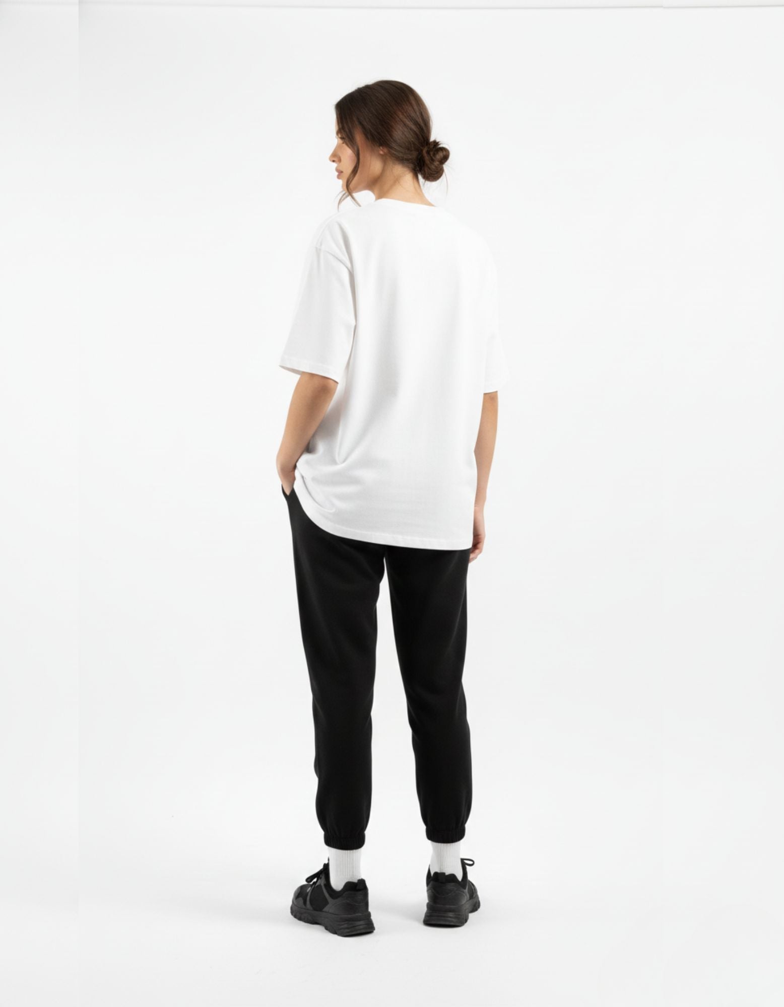 Back view of the GENZs Fashion white oversized streetwear tee, highlighting the clean silhouette and premium baggy fit.