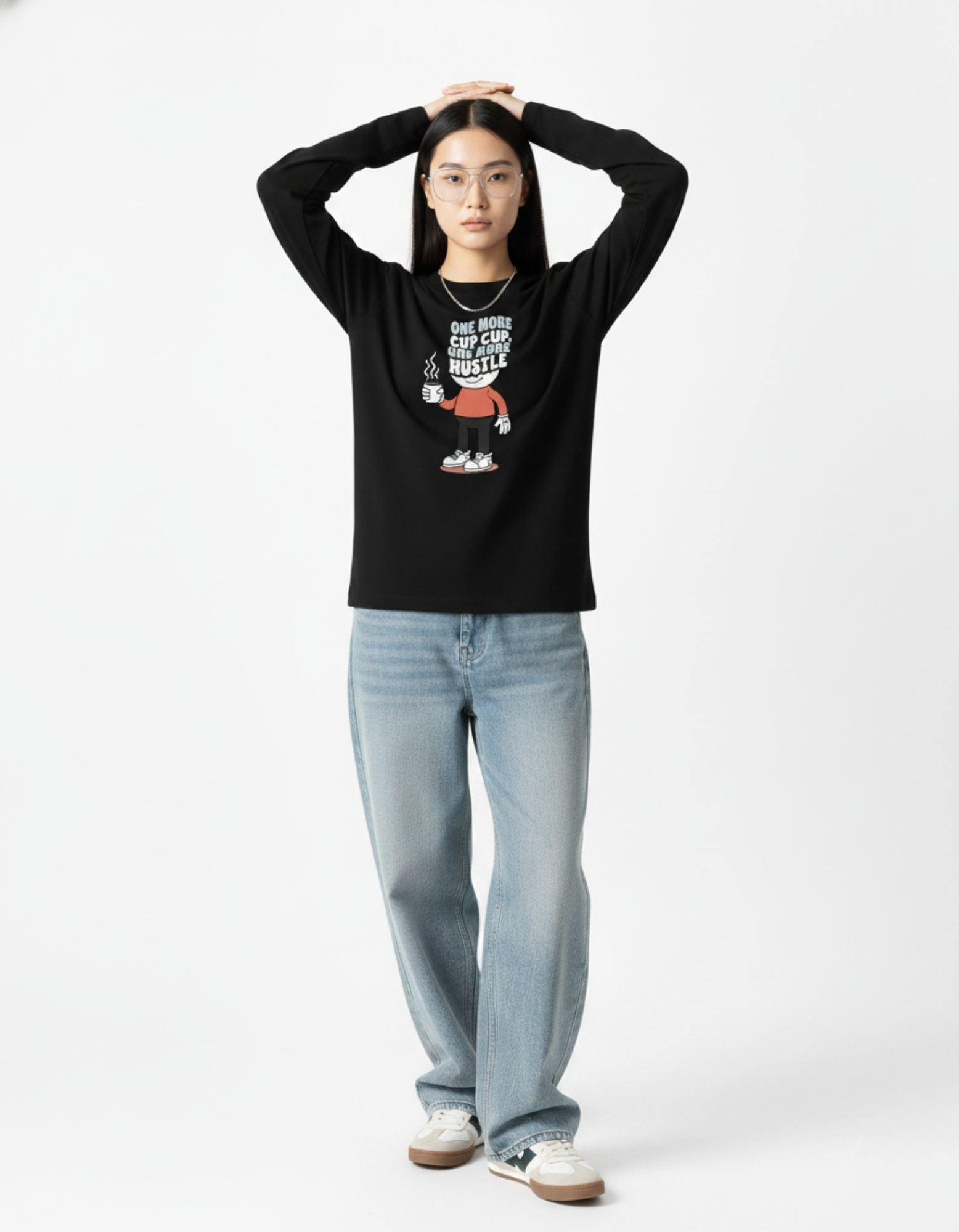 Full-length shot of a woman in a GENZs Fashion black graphic sweatshirt, demonstrating the "oversized everything" trend dominating 2025 Indian fashion.