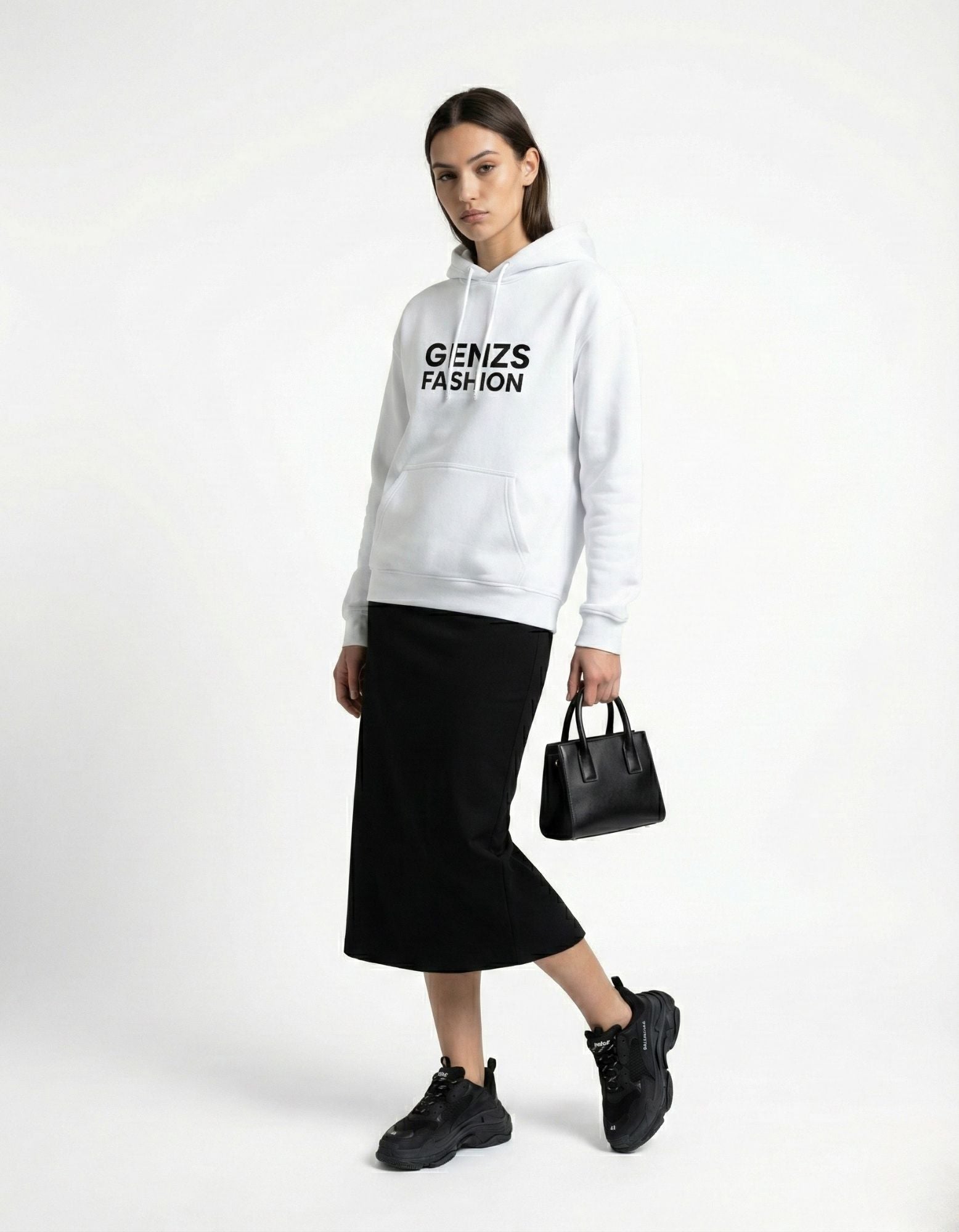 Female model styling a GENZs FASHION white hoodie with a black denim jacket and midi skirt.