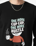 Close-up of GENZs Fashion black sweatshirt featuring "One More Cup, One More Hustle" 3D-style typography and coffee graphic for the minimalist hustler trend in India.