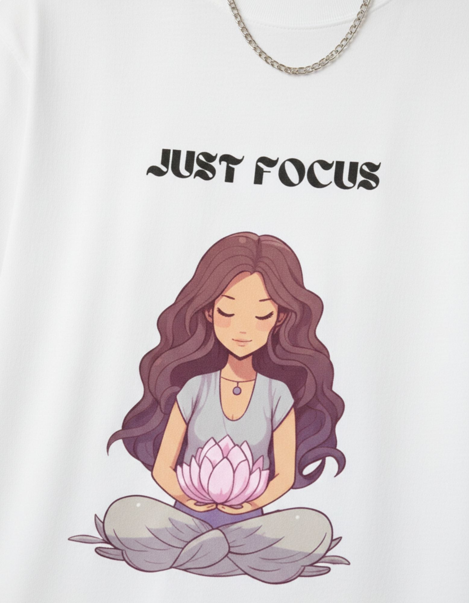 Close-up of "Just Focus" yoga meditation girl graphic print on white t-shirt.
