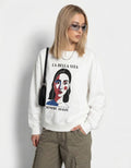 Close-up of a white 'La Bella Vita' sweatshirt featuring a vibrant minimalist face graphic and 'Sempre Avanti' text.