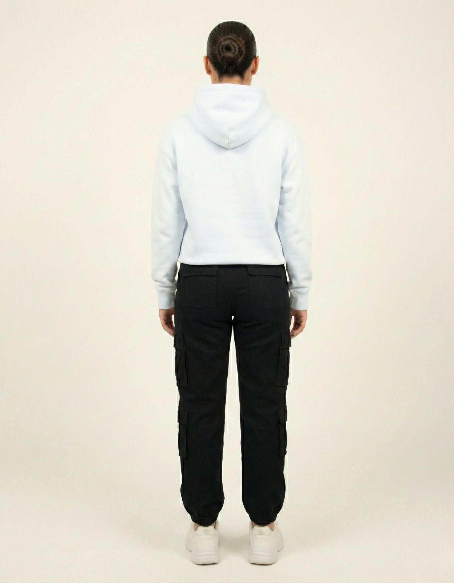 Back view of a light blue relaxed-fit streetwear hoodie for women, showcasing the clean design and premium fabric quality.