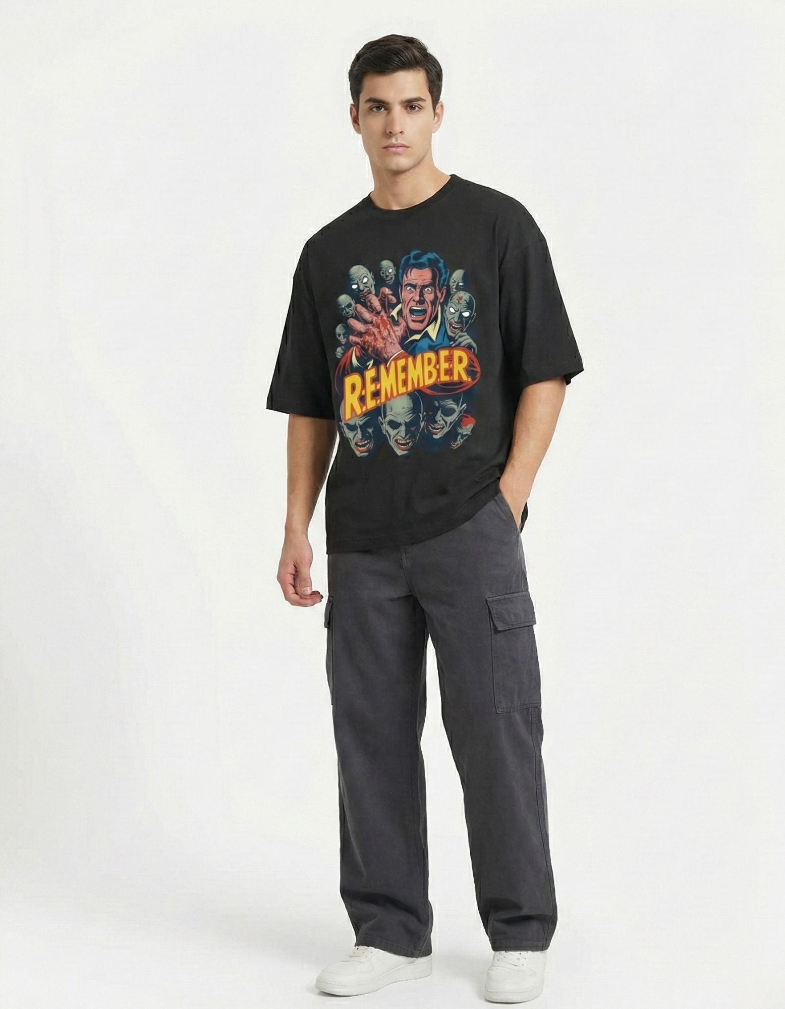 Male model wearing a black GENZs Fashion baggy-fit t-shirt with a detailed zombie horror illustration, perfect for the edgy urban fashion trend in Bangalore and Delhi.