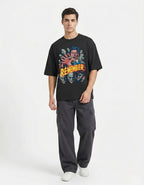 Front view of a man in a black GENZs Fashion horror graphic tee, representing the "Relentless Grind" and edgy aesthetic popular in Indian streetwear.