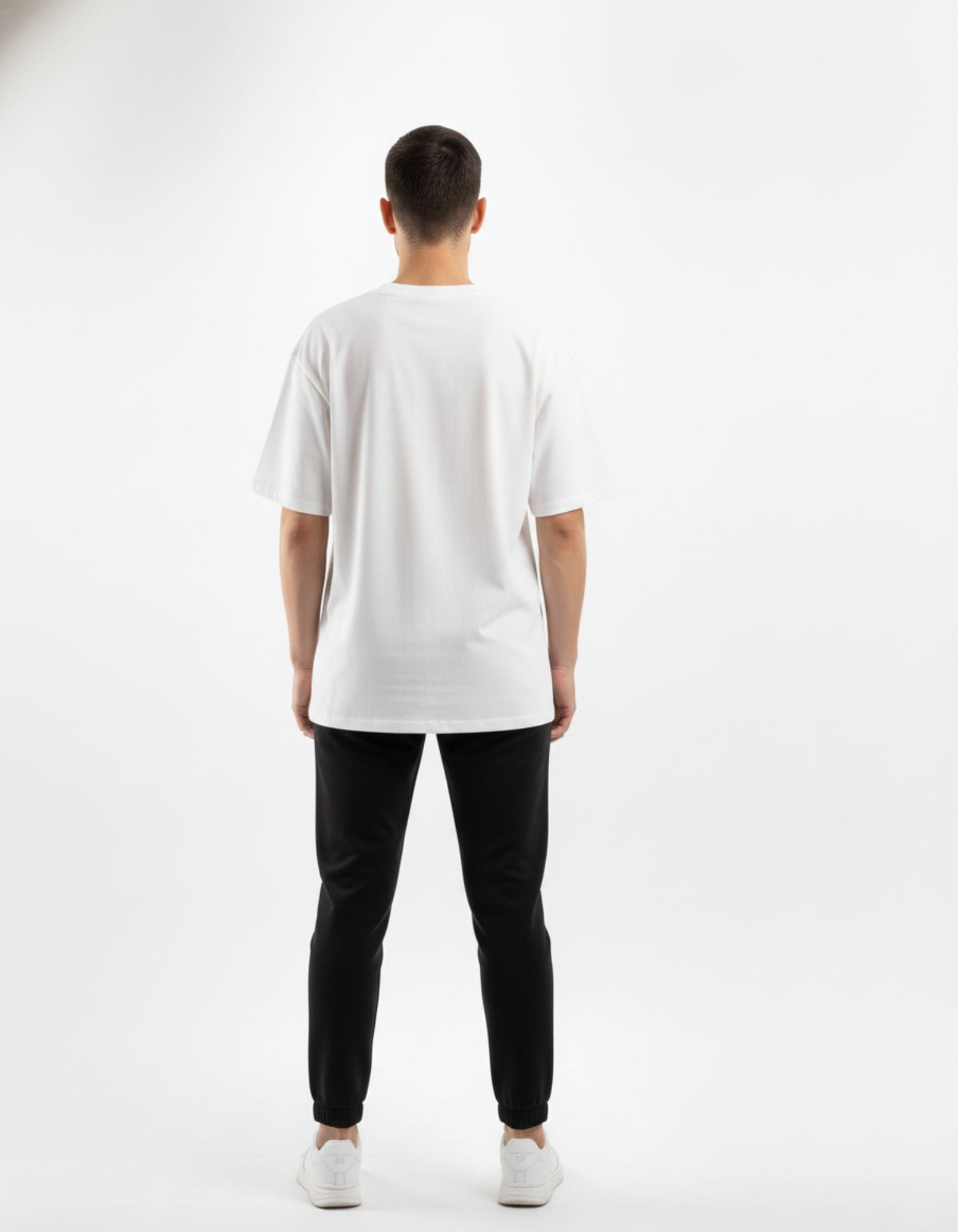 Rear view of a men's premium white oversized t-shirt from GENZs Fashion, showing the heavy cotton fabric quality.