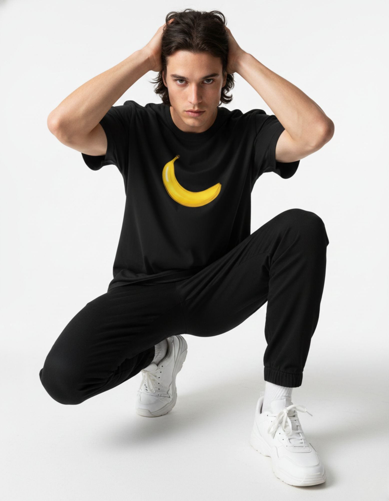 Male model in a GENZs Fashion black oversized t-shirt with a high-contrast yellow banana graphic.