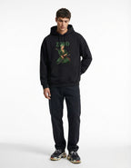 Front standing view of a male model in a black GENZs Fashion hoodie featuring a high-quality Roronoa Zoro illustration.