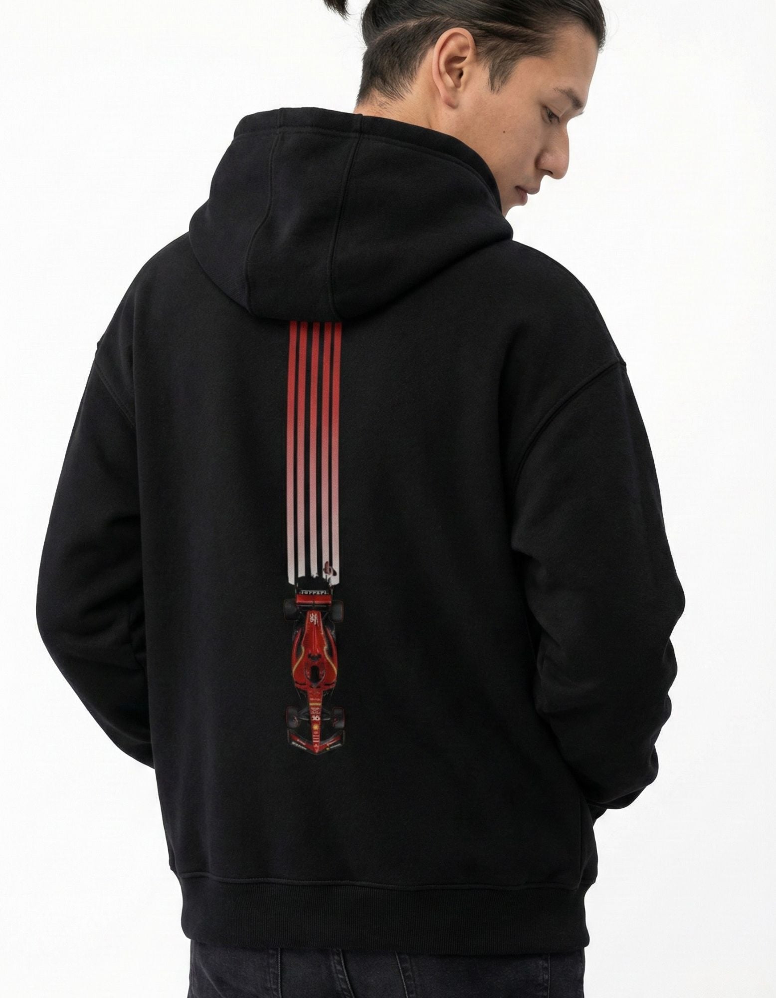 Male model wearing GENZs Fashion black hoodie featuring a vertical red F1 racing car design on the back, Grand Prix fan apparel.