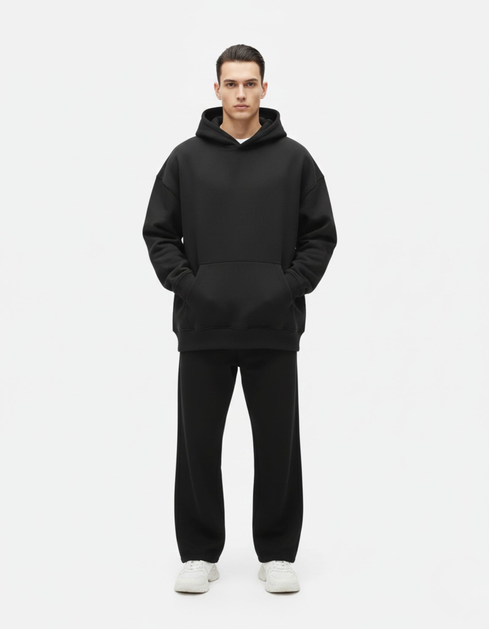 "Full front view of a male model in a premium black oversized hoodie by GENZs Fashion, highlighting the baggy, comfortable fit."