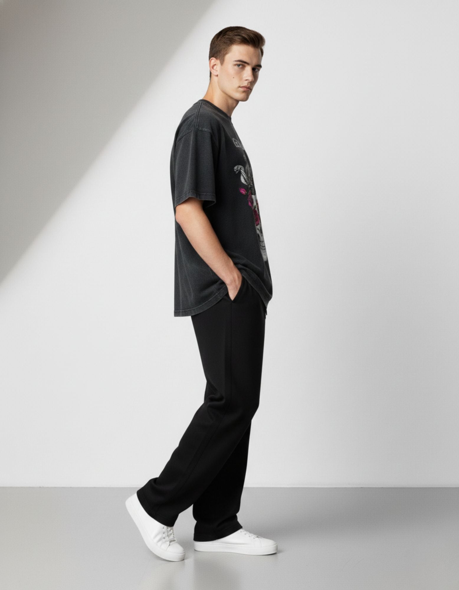 Male model wearing GENZs Fashion black oversized graphic t-shirt with skull and rose design, a must-have for Gen Z fashion in India.