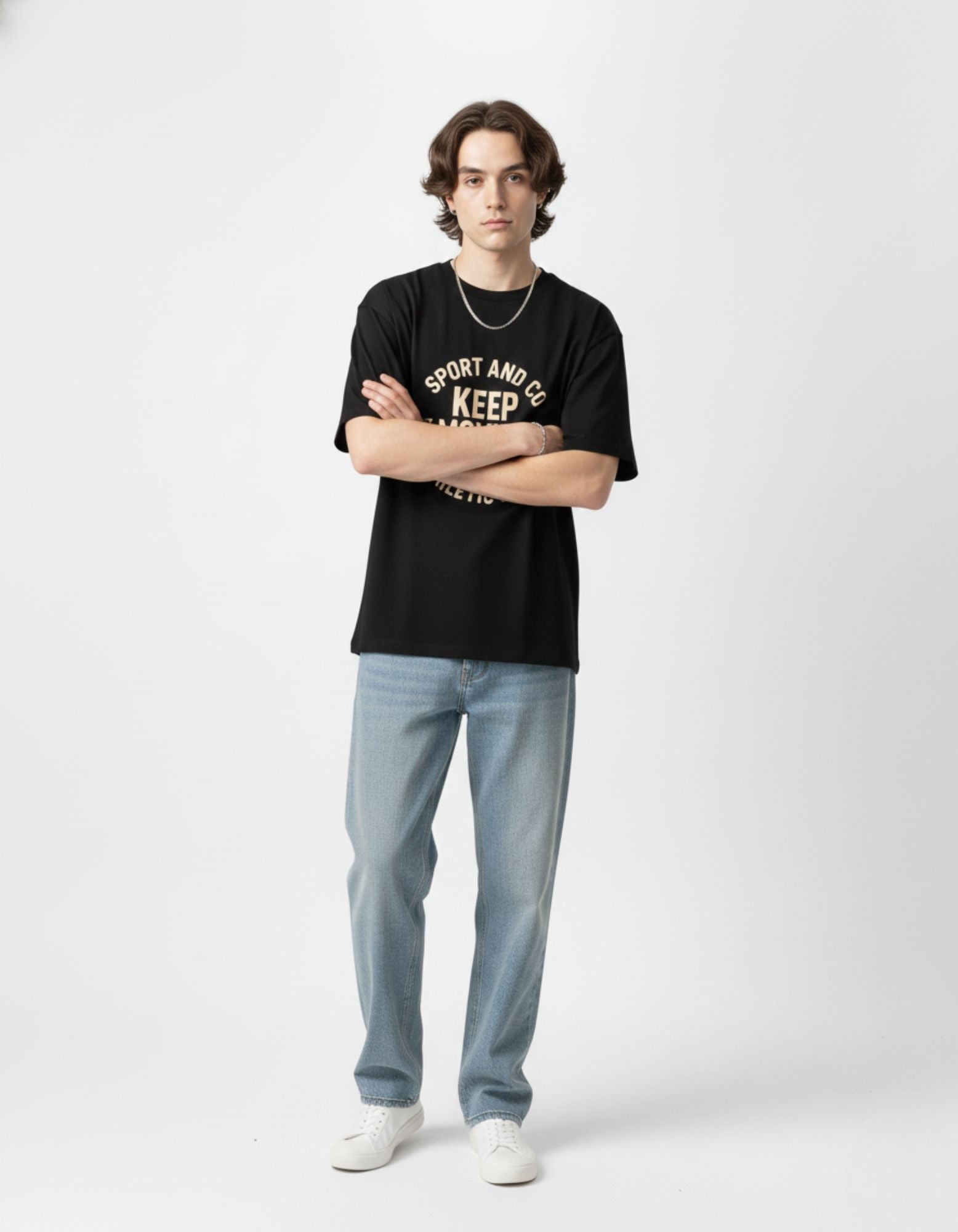 Stylish casual black oversized tee for women, paired with wide-leg light-wash denim for an urban Indian look.