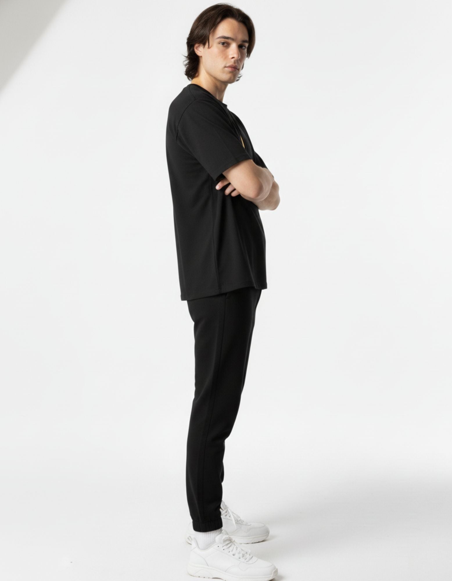 Side view of a minimalist black t-shirt by GENZs Fashion highlighting the premium streetwear silhouette.