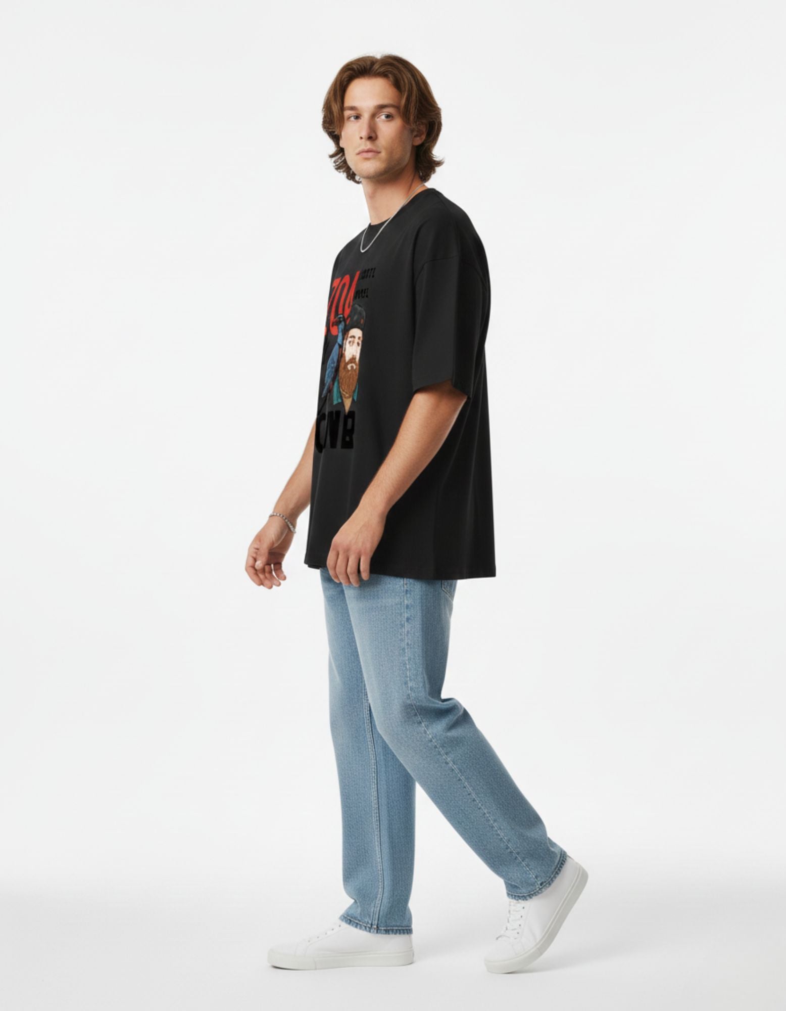 Side view of a black drop-shoulder streetwear tee for men, featuring a high-quality artistic graphic print.