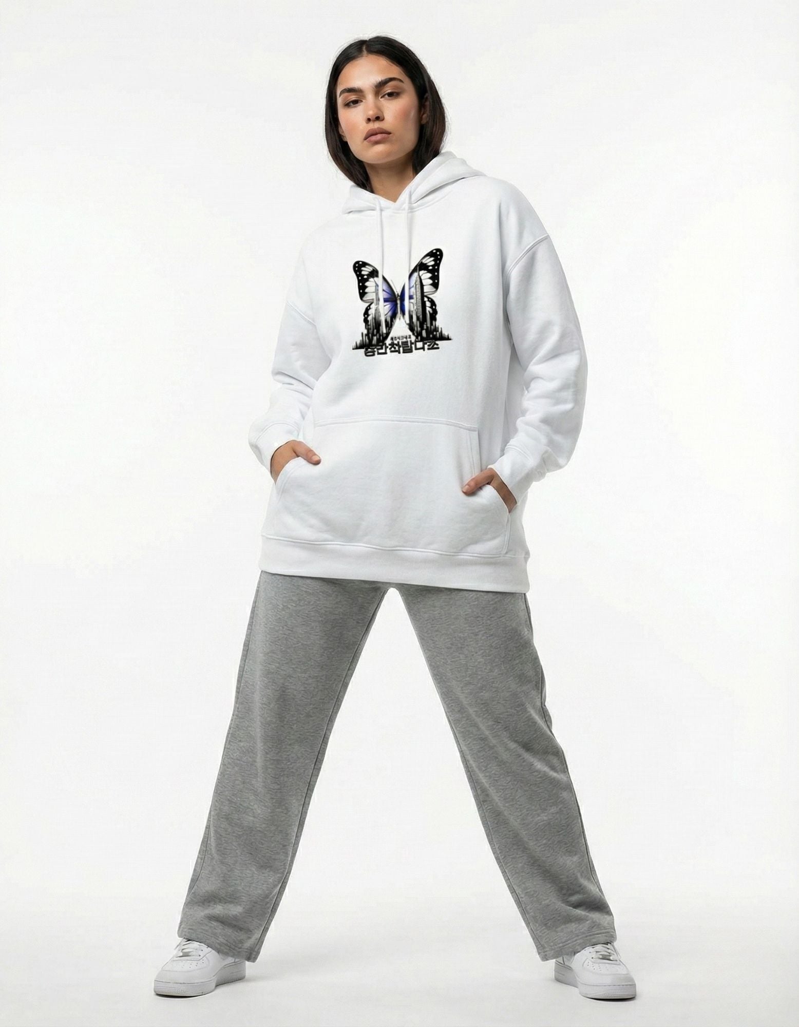 Front view of white oversized hoodie featuring a blue and black butterfly graphic, Y2K aesthetic by GENZs Fashion.