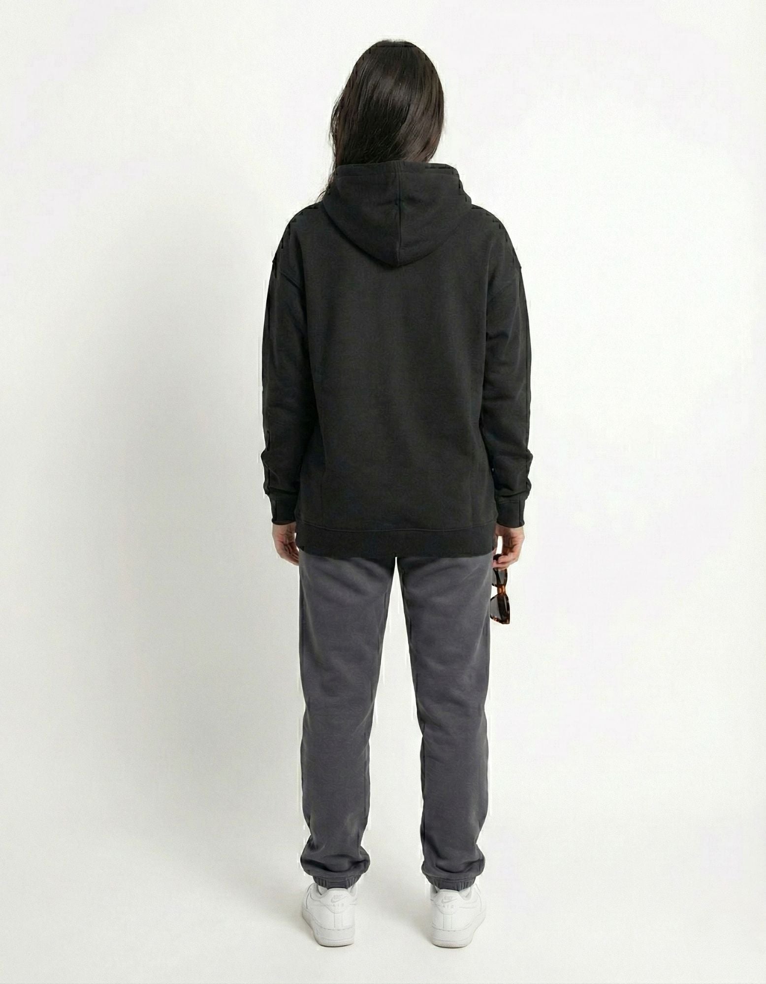Back view of black oversized hoodie showing clean oversized fit