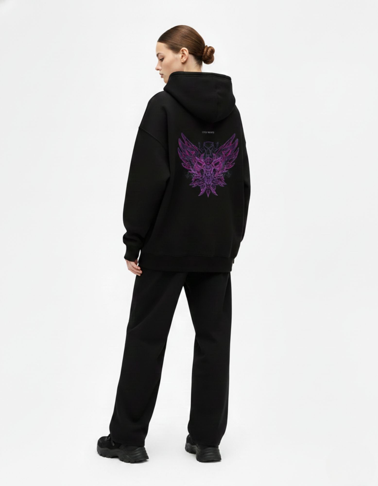 Back view of black oversized hoodie with graphic design by Genzs Fashion